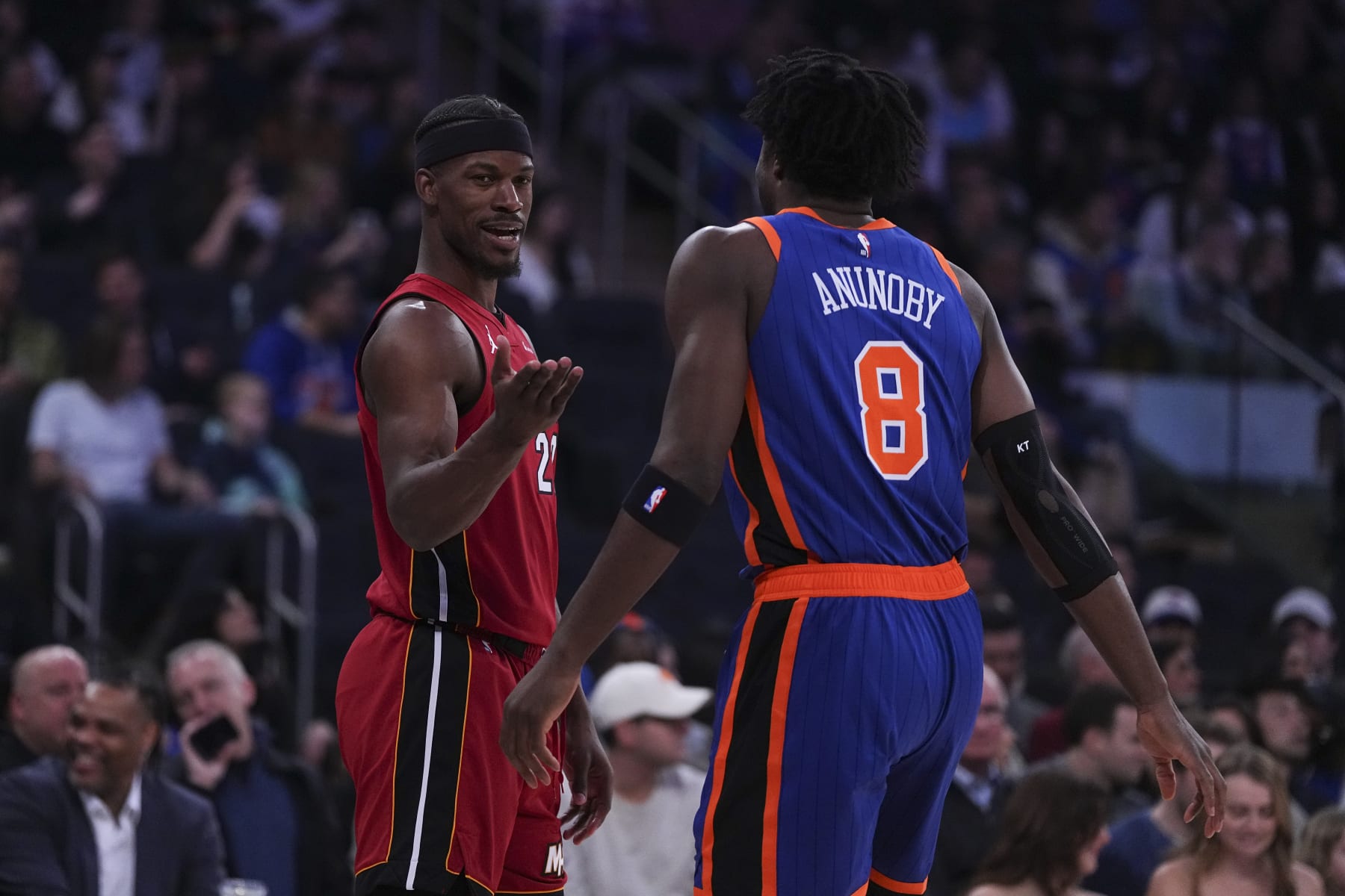 NEW YORK, NEW YORK - JANUARY 27: Jimmy Butler #22 of the Miami Heat talks to OG Anunoby #8 of the New York Knicks at Madison Square Garden on January 27, 2024 in New York City. NOTE TO USER: User expressly acknowledges and agrees that, by downloading and or using this photograph, User is consenting to the terms and conditions of the Getty Images License Agreement. (Photo by Mitchell Leff/Getty Images)