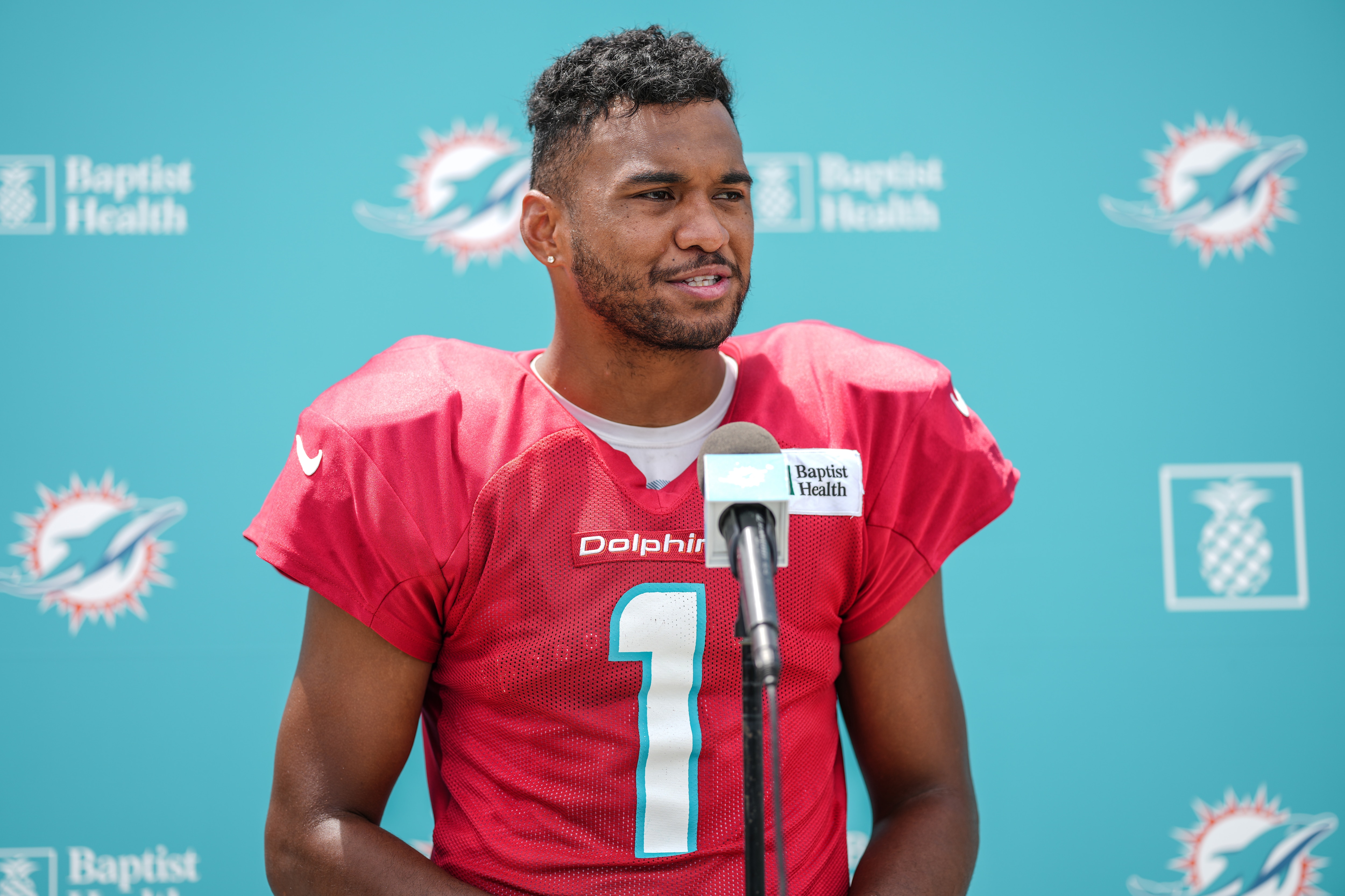 MIAMI GARDENS, FLORIDA - AUGUST 25: Quarterback Tua Tagovailoa #1 of the Miami Dolphins speaks with the media during Training Camp at Baptist Health Training Complex on August 25, 2021 in Miami Gardens, Florida. (Photo by Mark Brown/Getty Images)
