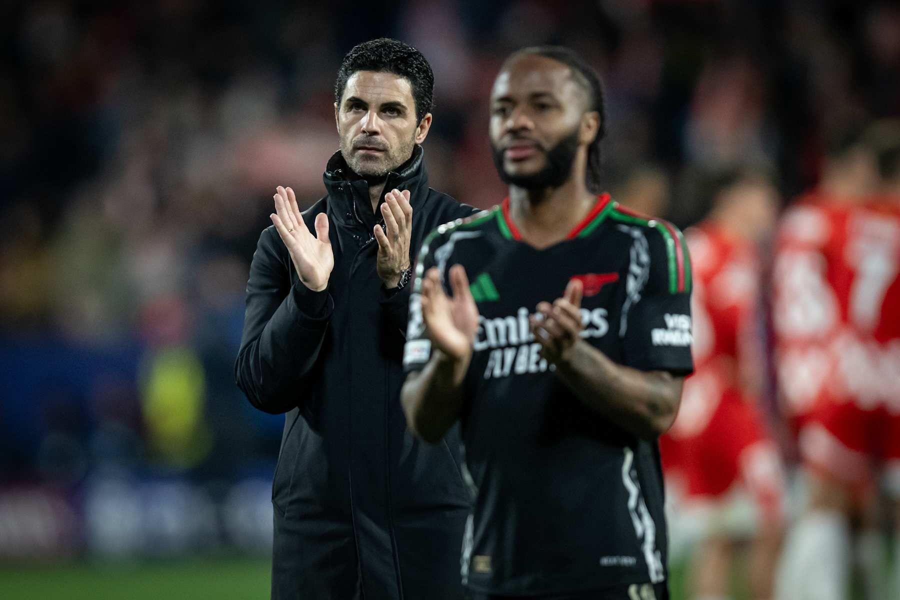 Mikel Arteta and Raheem Sterling.
