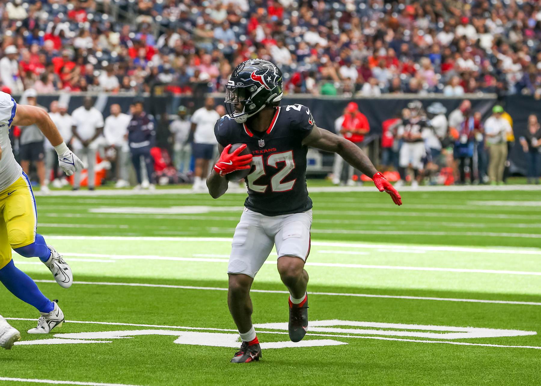 HOUSTON, TX - AUGUST 24:  Houston Texans running back Cam Akers (22) carries the ball during the NFL preseason game between the Los Angeles Rams and Houston Texans on August 24, 2024 at NRG Stadium in Houston, Texas.  (Photo by Leslie Plaza Johnson/Icon Sportswire via Getty Images)