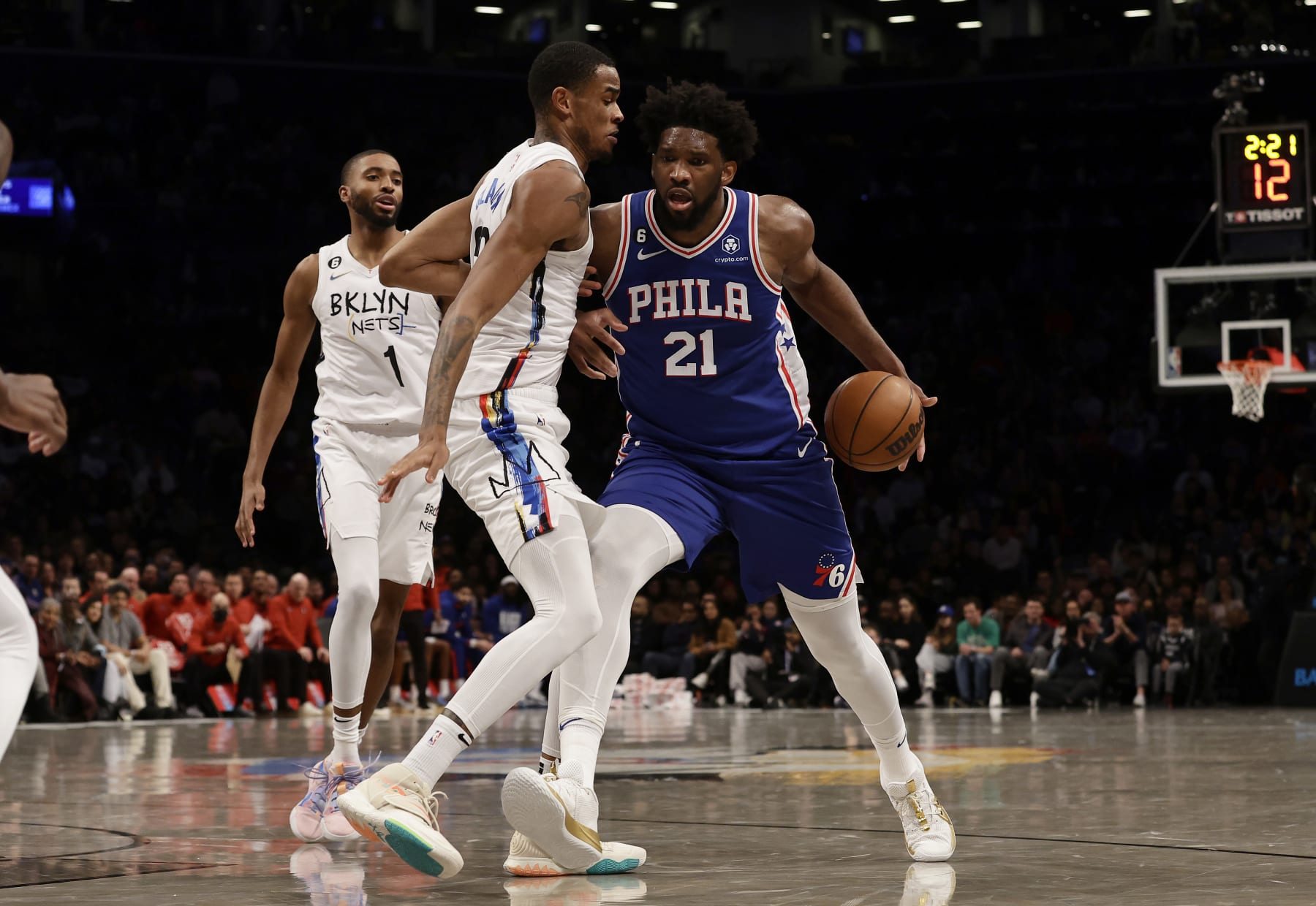 NEW YORK, NEW YORK - FEBRUARY 11: (NEW YORK DAILIES OUT)  Joel Embiid #21 of the Philadelphia 76ers in action against Nic Claxton #33 of the Brooklyn Nets at Barclays Center on February 11, 2023 in New York City. The 76ers defeated the Nets 101-98. NOTE TO USER: User expressly acknowledges and agrees that, by downloading and or using this photograph, User is consenting to the terms and conditions of the Getty Images License Agreement. (Photo by Jim McIsaac/Getty Images)