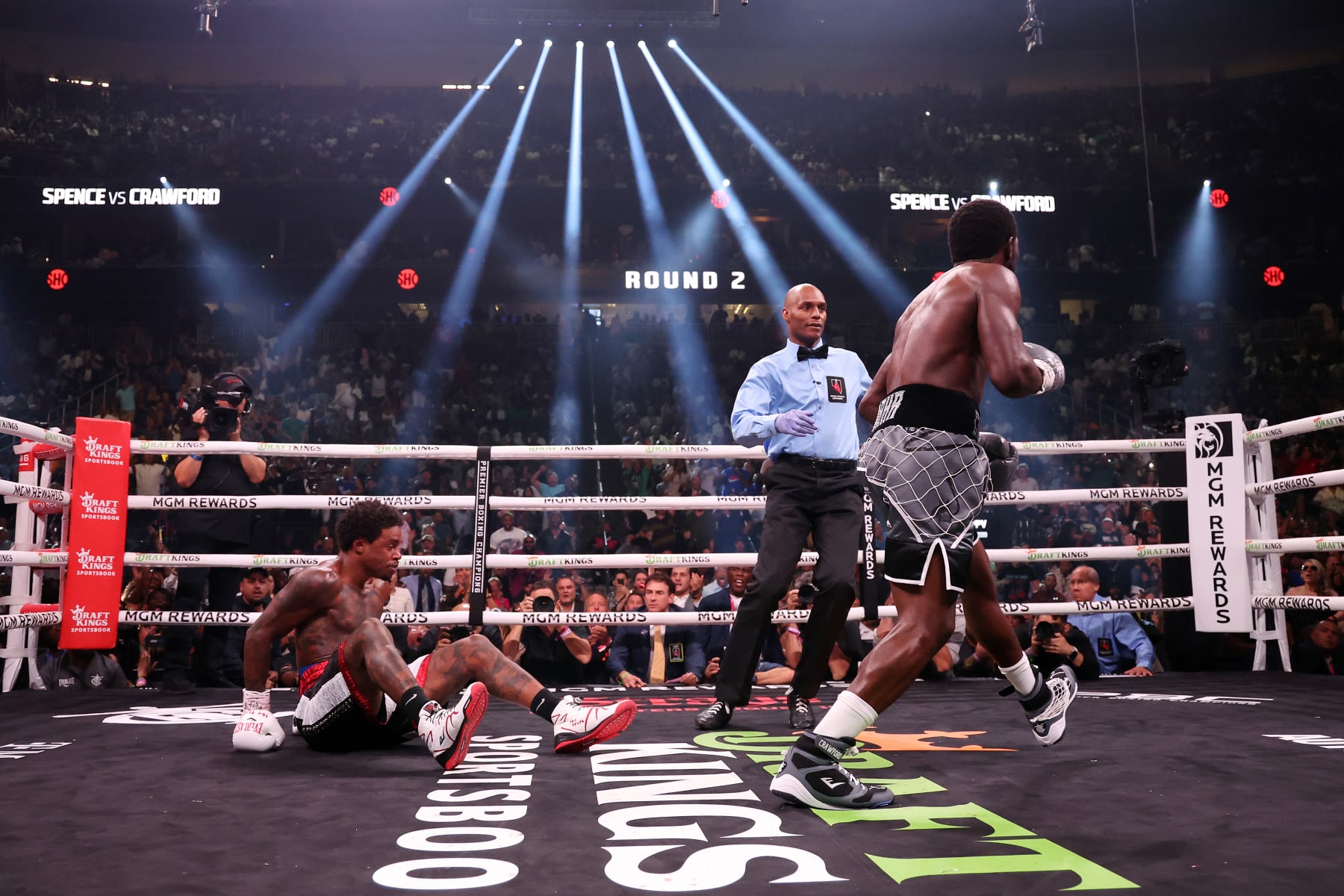 LAS VEGAS, NEVADA - JULY 29: Terrence Crawford punches down Errol Spence Jr. during round 2 of the World Welterweight Championship bout at T-Mobile Arena on July 29, 2023 in Las Vegas, Nevada. (Photo by Al Bello/Getty Images)