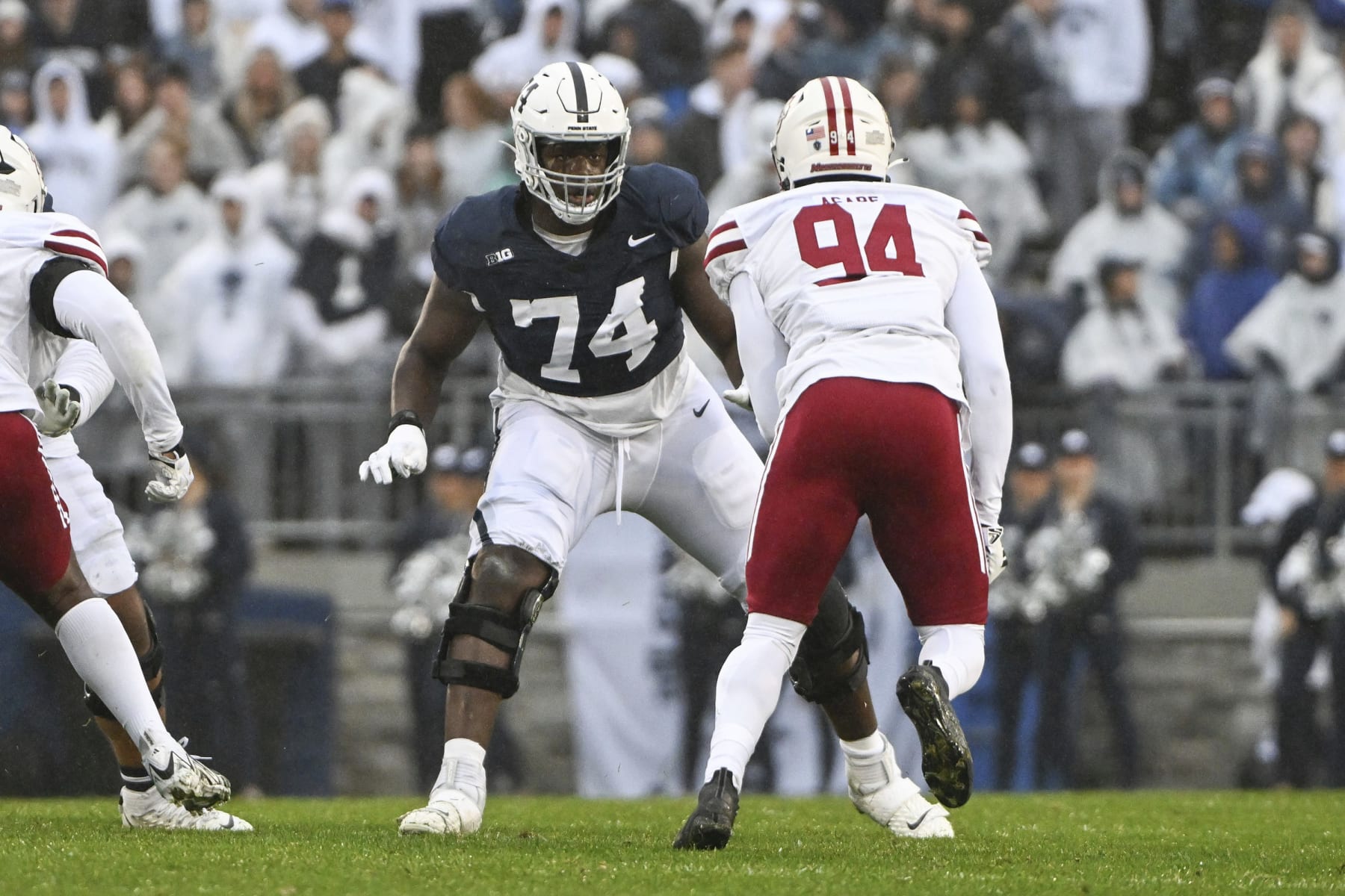Penn State offensive lineman Olumuyiwa Fashanu (74) looks to block Massachusetts defensive end Kofi Asare (94) during the first half of an NCAA college football game, Saturday, Oct. 14, 2023, in State College, Pa. (AP Photo/Barry Reeger)