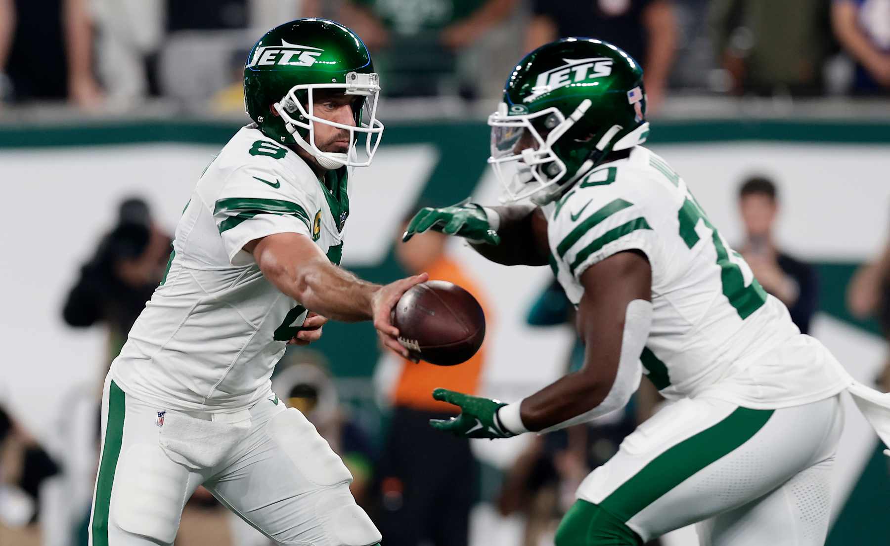 EAST RUTHERFORD, NEW JERSEY - SEPTEMBER 11: (NEW YORK DAILIES OUT)  Aaron Rodgers #8 and Breece Hall #20 of the New York Jets in action against the Buffalo Bills at MetLife Stadium on September 11, 2023 in East Rutherford, New Jersey. The Jets defeated the Bills 22-16 in overtime. (Photo by Jim McIsaac/Getty Images)