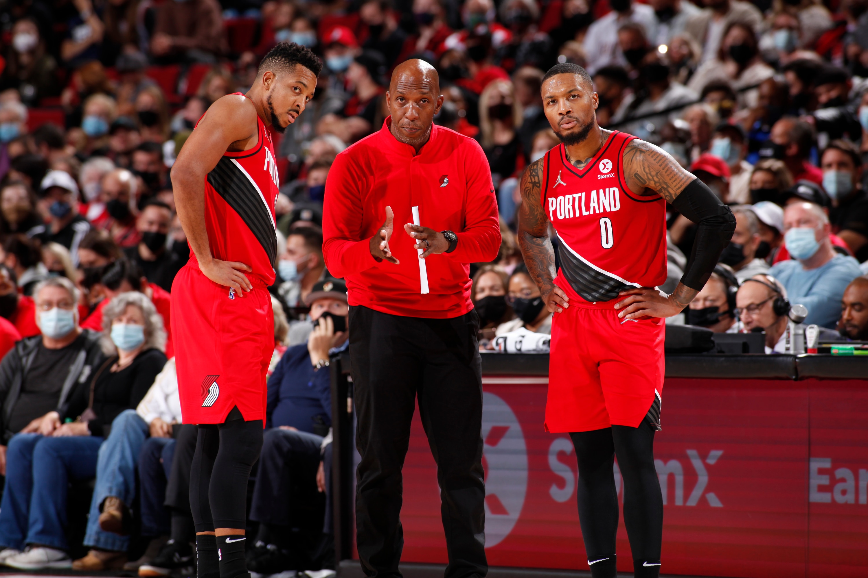 PORTLAND, OR - OCTOBER 29: Head Coach Chauncey Billups chats with C.J. McCollum #3 and Damian Lillard #0 of the Portland Trail Blazers against the LA Clippers on October 29, 2021 at the Moda Center in Portland, Oregon. NOTE TO USER: User expressly acknowledges and agrees that, by downloading and or using this photograph, user is consenting to the terms and conditions of the Getty Images License Agreement. Mandatory Copyright Notice: Copyright 2021 NBAE (Photo by Cameron Browne/NBAE via Getty Images)