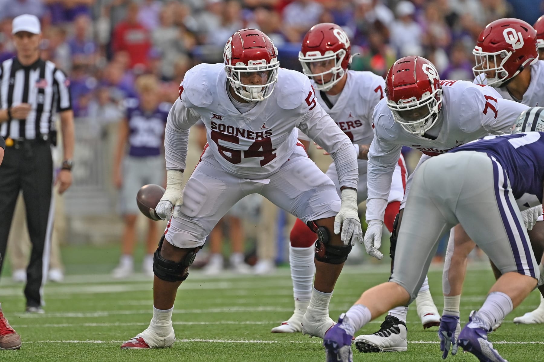 MANHATTAN, KS - OCTOBER 02:  Offensive lineman Wanya Morris #64 of the Oklahoma Sooners gets set on the line of scrimmage during the second half against the Kansas State Wildcats at Bill Snyder Family Football Stadium on October 2, 2021 in Manhattan, Kansas. (Photo by Peter G. Aiken/Getty Images)