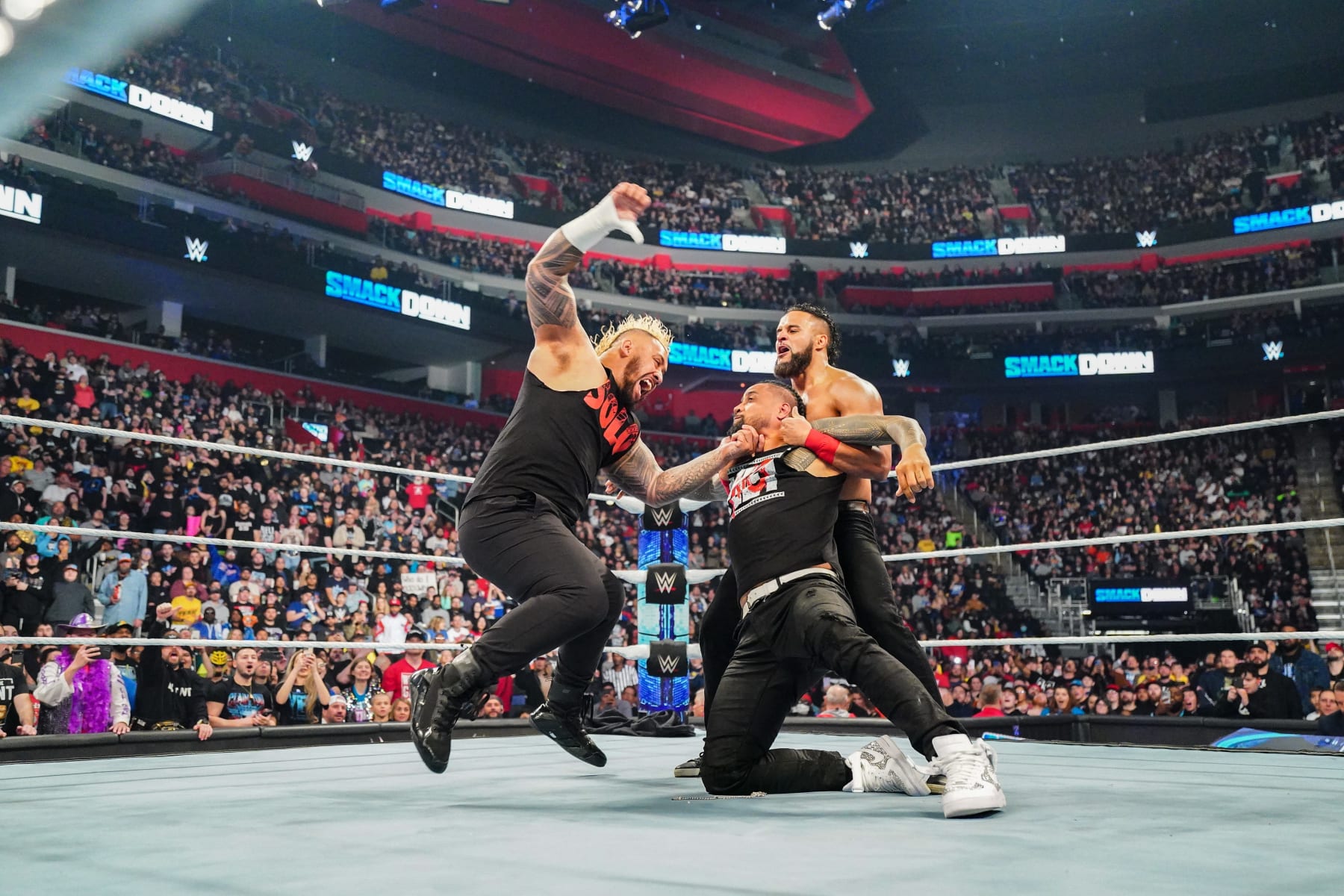 DETROIT, MICHIGAN - APRIL 12: Solo Sikoa gives Jimmy Uso a samoan spike while being held by Tama Tonga during Friday Night Smackdown at Little Caesars Arena on April 12, 2024 in Detroit, Michigan. (Photo by WWE/Getty Images)