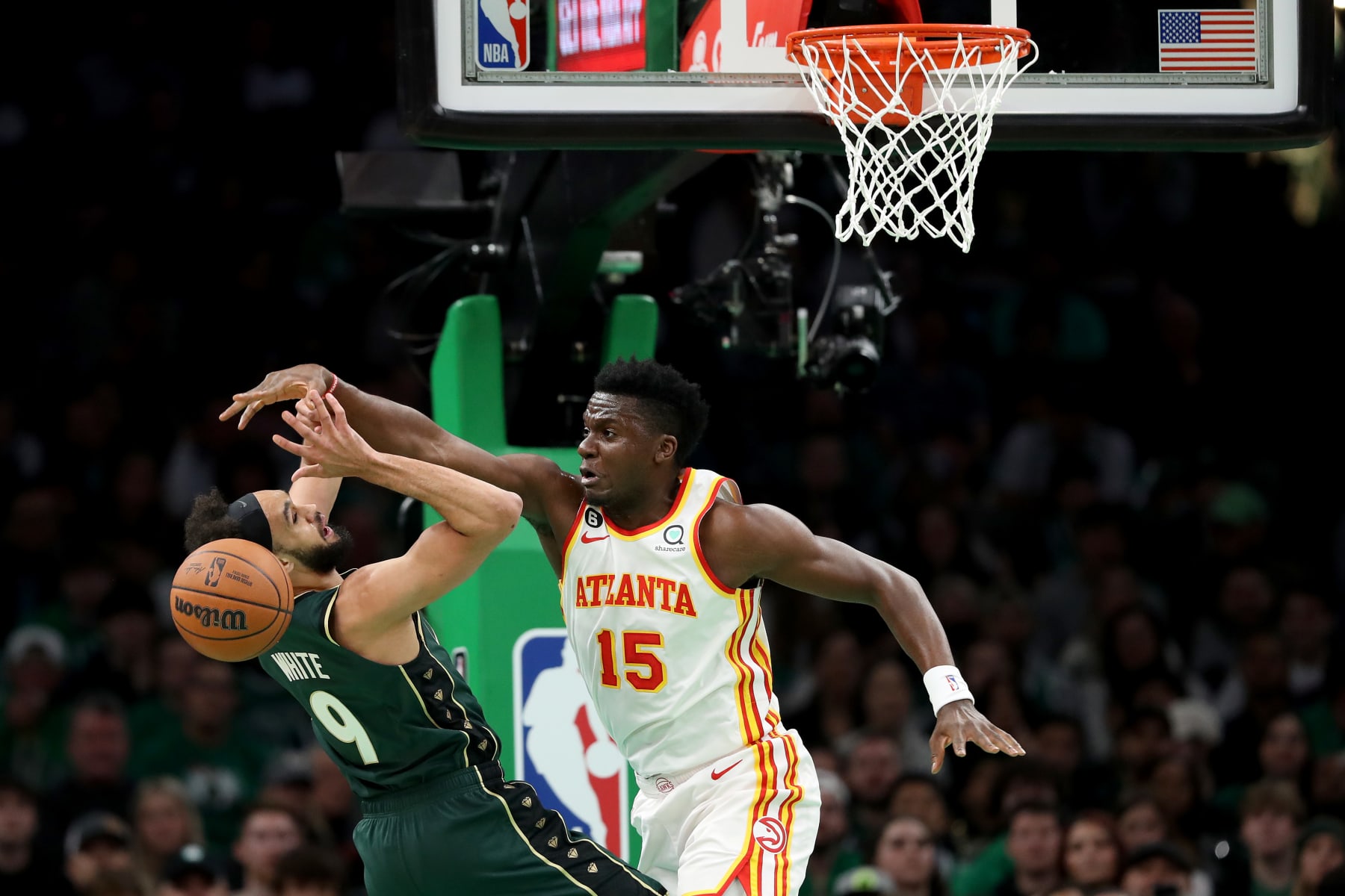 BOSTON, MASSACHUSETTS - APRIL 25: Clint Capela #15 of the Atlanta Hawks blocks a shot by Derrick White #9 of the Boston Celtics during the first quarter in game five of the Eastern Conference First Round Playoffs at TD Garden on April 25, 2023 in Boston, Massachusetts. NOTE TO USER: User expressly acknowledges and agrees that, by downloading and or using this photograph, User is consenting to the terms and conditions of the Getty Images License Agreement. (Photo by Maddie Meyer/Getty Images)