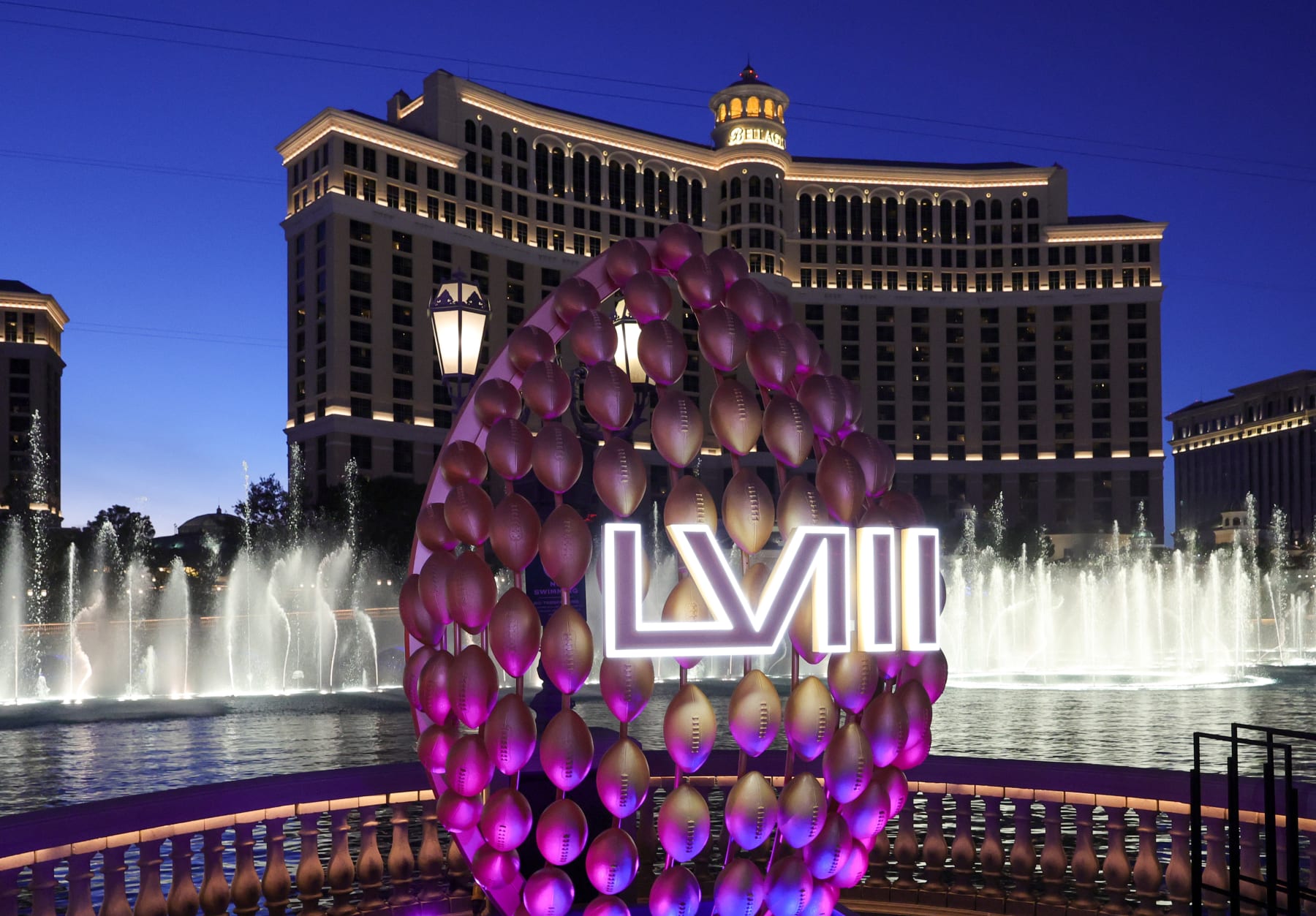 LAS VEGAS, NEVADA - FEBRUARY 03: The Fountains of Bellagio  launch behind a display of footballs with a Super Bowl LVIII logo on the CBS Sports set being built for the game in front of Bellagio Resort & Casino on February 03, 2024 in Las Vegas, Nevada. The game will be played on February 11, 2024, between the San Francisco 49ers and the Kansas City Chiefs at Allegiant Stadium. (Photo by Ethan Miller/Getty Images)