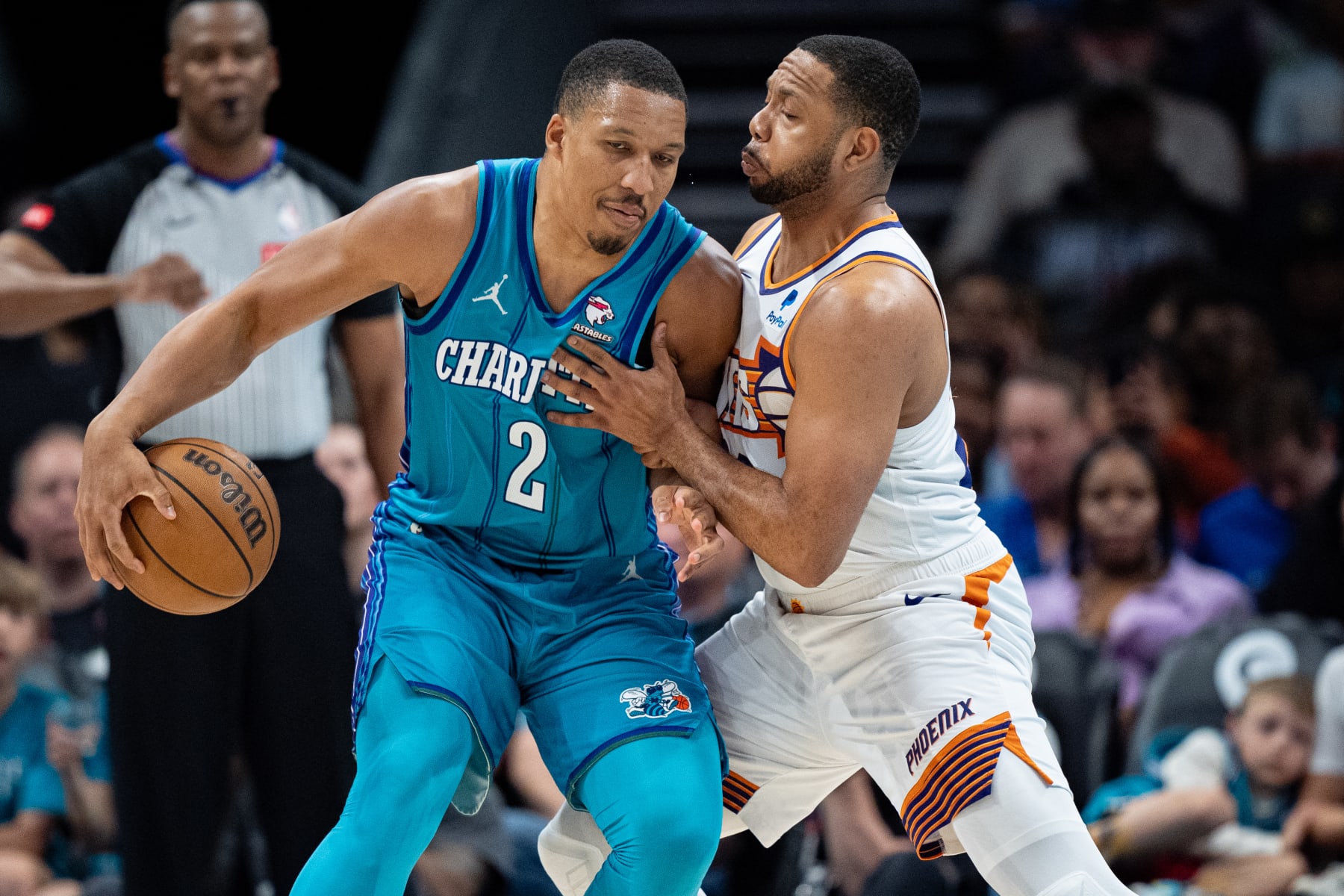 CHARLOTTE, NORTH CAROLINA - MARCH 15: Eric Gordon #23 of the Phoenix Suns guards Grant Williams #2 of the Charlotte Hornets in the third quarter during their game at Spectrum Center on March 15, 2024 in Charlotte, North Carolina. NOTE TO USER: User expressly acknowledges and agrees that, by downloading and or using this photograph, User is consenting to the terms and conditions of the Getty Images License Agreement. (Photo by Jacob Kupferman/Getty Images)