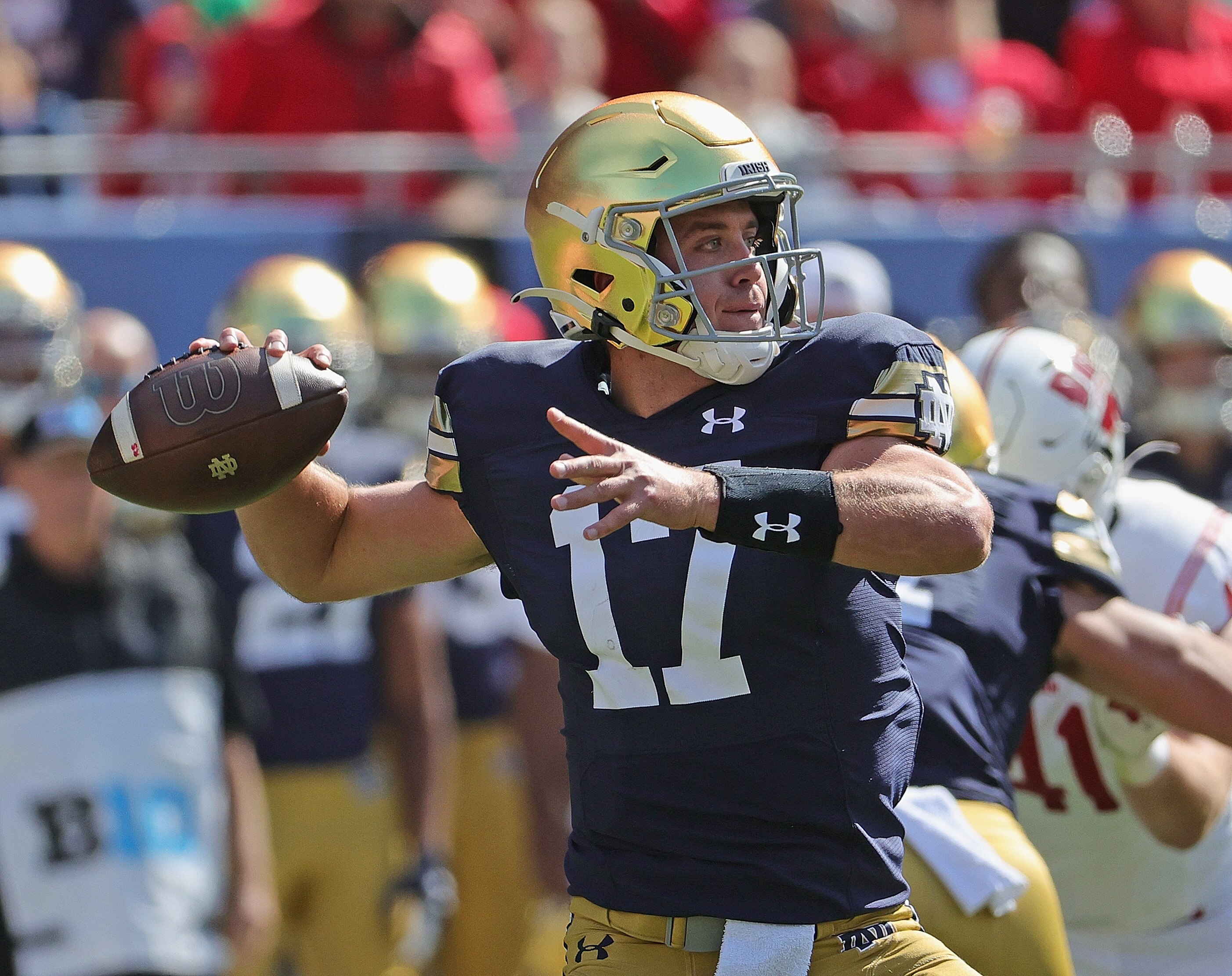 CHICAGO, ILLINOIS - SEPTEMBER 25: Jack Coan #17 of the Notre Dame Fighting Irish passes against the Wisconsin Badgers at Soldier Field on September 25, 2021 in Chicago, Illinois. (Photo by Jonathan Daniel/Getty Images)