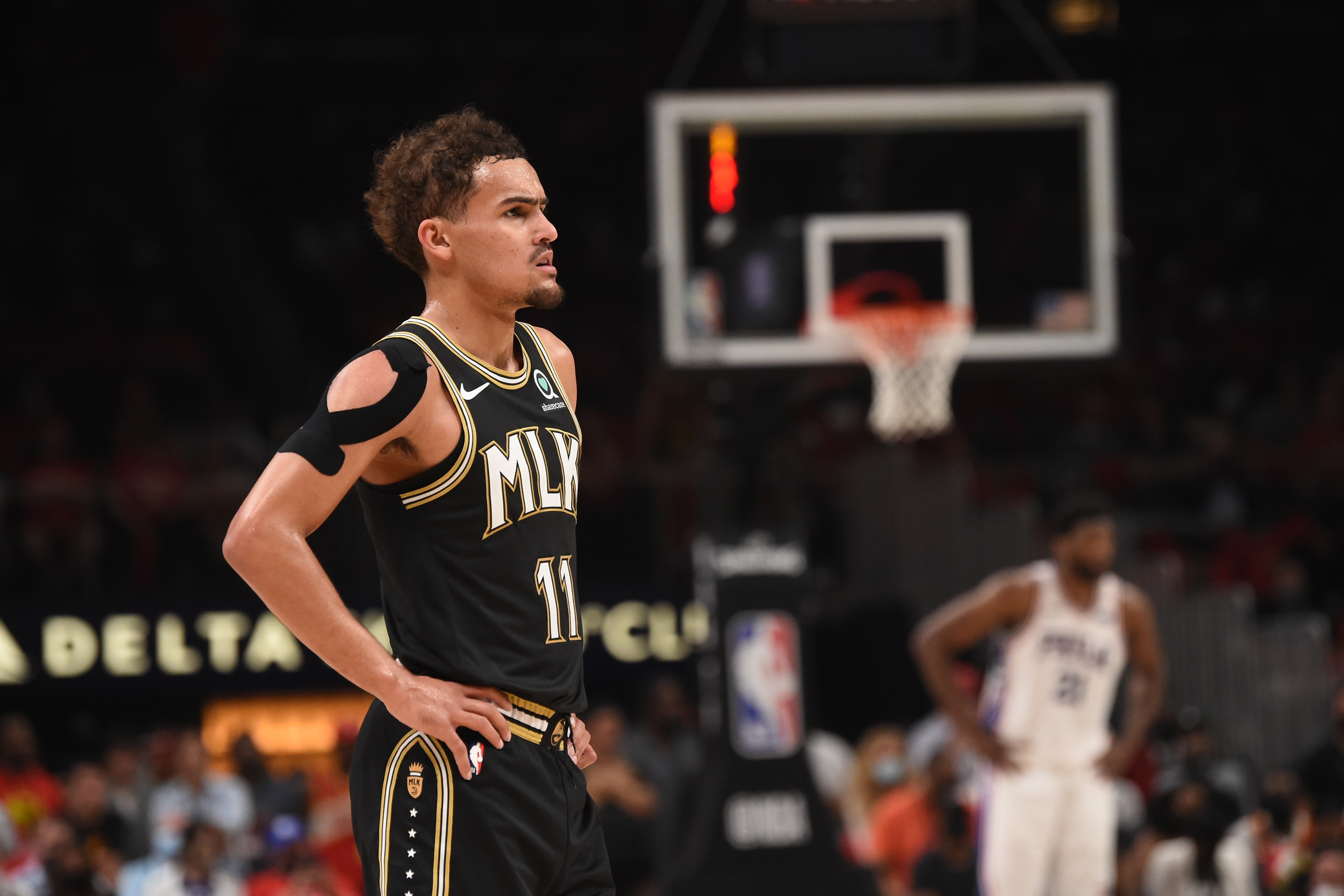 ATLANTA, GA - JUNE 14: Trae Young #11 of the Atlanta Hawks looks on during a game against the Philadelphia 76ers during Round 2, Game 4 of the Eastern Conference Playoffs on June 14, 2021 at State Farm Arena in Atlanta, Georgia. NOTE TO USER: User expressly acknowledges and agrees that, by downloading and/or using this Photograph, user is consenting to the terms and conditions of the Getty Images License Agreement. Mandatory Copyright Notice: Copyright 2021 NBAE (Photo by David Dow/NBAE via Getty Images)
