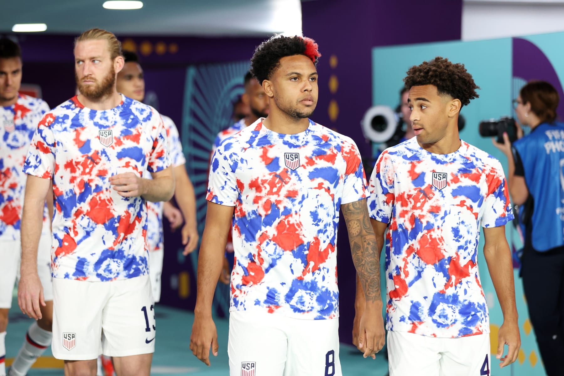 DOHA, QATAR - DECEMBER 03: Tim Ream, Weston McKennie and Tyler Adams of United States enter the pitch to warm up prior to the FIFA World Cup Qatar 2022 Round of 16 match between Netherlands and USA at Khalifa International Stadium on December 03, 2022 in Doha, Qatar. (Photo by Patrick Smith - FIFA/FIFA via Getty Images)