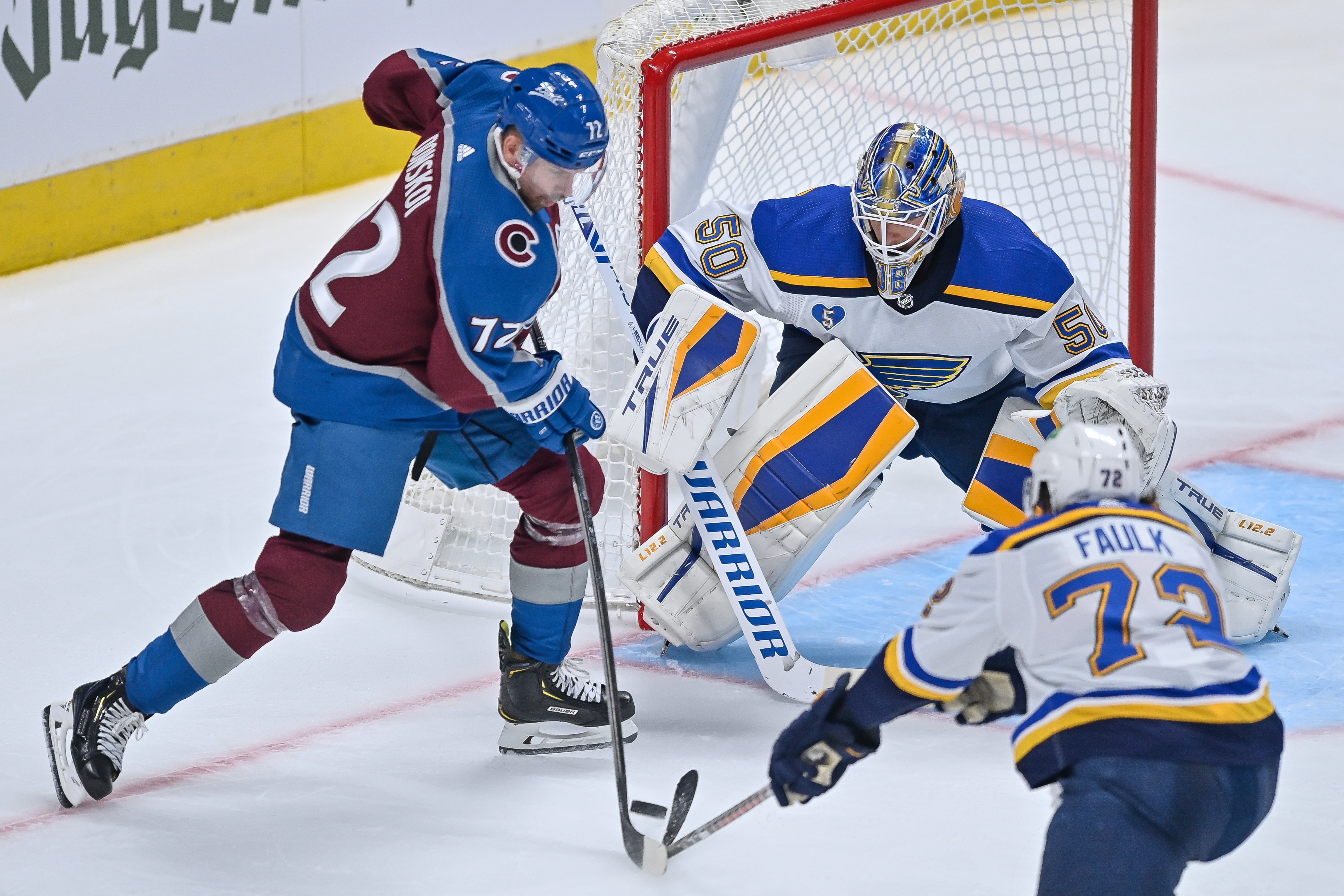 DENVER, CO - MAY 17: St. Louis Blues goaltender Jordan Binnington (50) stands in front of the net as Colorado Avalanche right wing Joonas Donskoi (72) attempts a shot during a Stanley Cup Playoffs first round game between the St. Louis Blues and the Colorado Avalanche at Ball Arena in Denver, Colorado on May 17, 2021. (Photo by Dustin Bradford/Icon Sportswire via Getty Images)