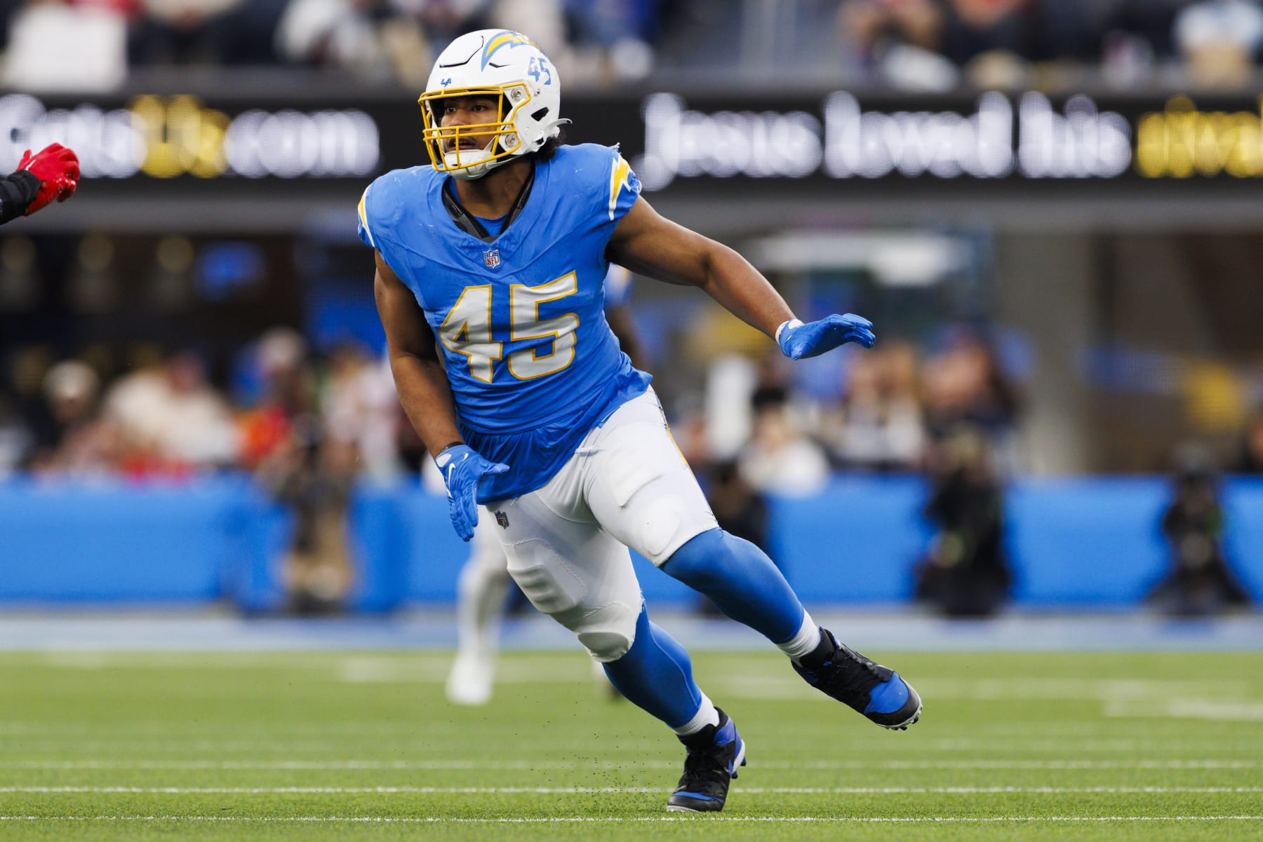 INGLEWOOD, CALIFORNIA - JANUARY 7: Tuli Tuipulotu #45 of the Los Angeles Chargers rushes the edge during a game against the Kansas City Chiefs at SoFi Stadium on January 7, 2024 in Inglewood, California. (Photo by Ric Tapia/Getty Images)