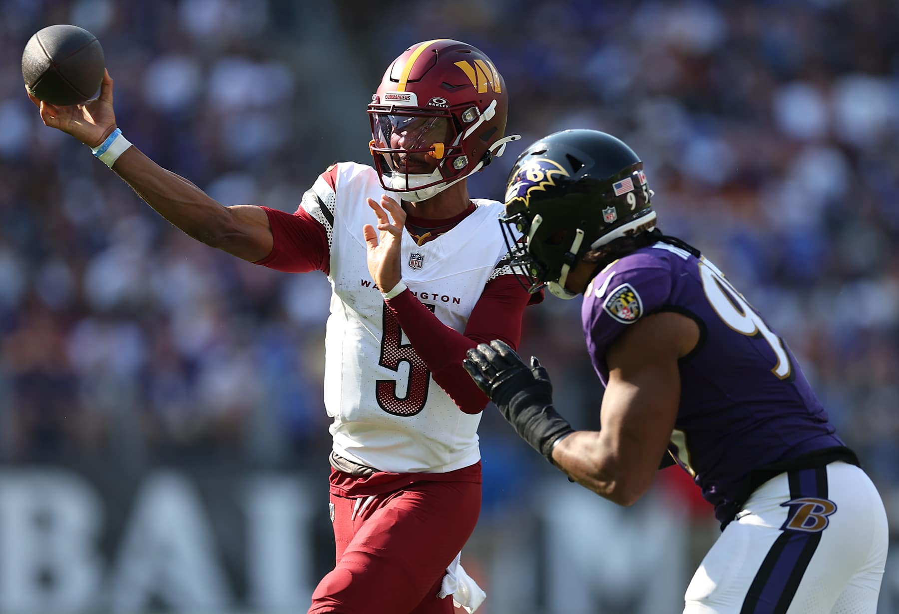 BALTIMORE, MARYLAND - OCTOBER 13: Jayden Daniels #5 of the Washington Commanders throws a pass against the Baltimore Ravens during the fourth quarter at M&T Bank Stadium on October 13, 2024 in Baltimore, Maryland. (Photo by Rob Carr/Getty Images)