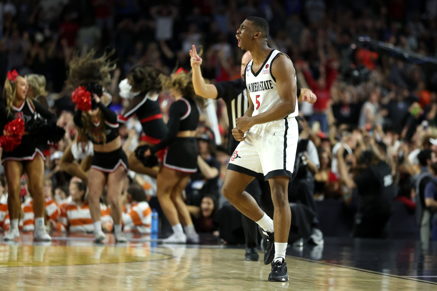 HOUSTON, TEXAS - APRIL 01: Lamont Butler #5 of the San Diego State Aztecs reacts after making a game winning basket to defeat the Florida Atlantic Owls 72-71 during the NCAA Men's Basketball Tournament Final Four semifinal game at NRG Stadium on April 01, 2023 in Houston, Texas. (Photo by Gregory Shamus/Getty Images)