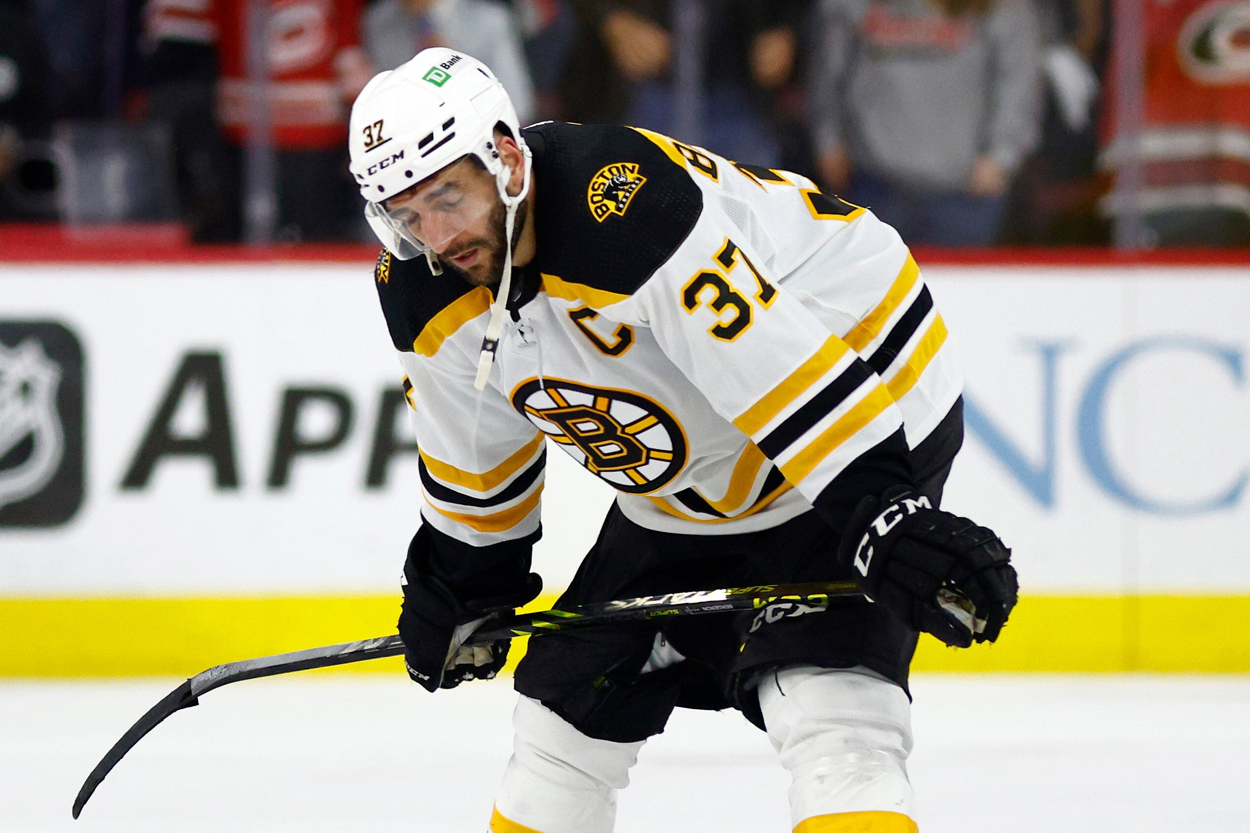RALEIGH, NORTH CAROLINA - MAY 14: Patrice Bergeron #37 of the Boston Bruins reacts following their 2-3 loss to the Carolina Hurricanes in Game Seven of the First Round of the 2022 Stanley Cup Playoffs at PNC Arena on May 14, 2022 in Raleigh, North Carolina. (Photo by Jared C. Tilton/Getty Images)