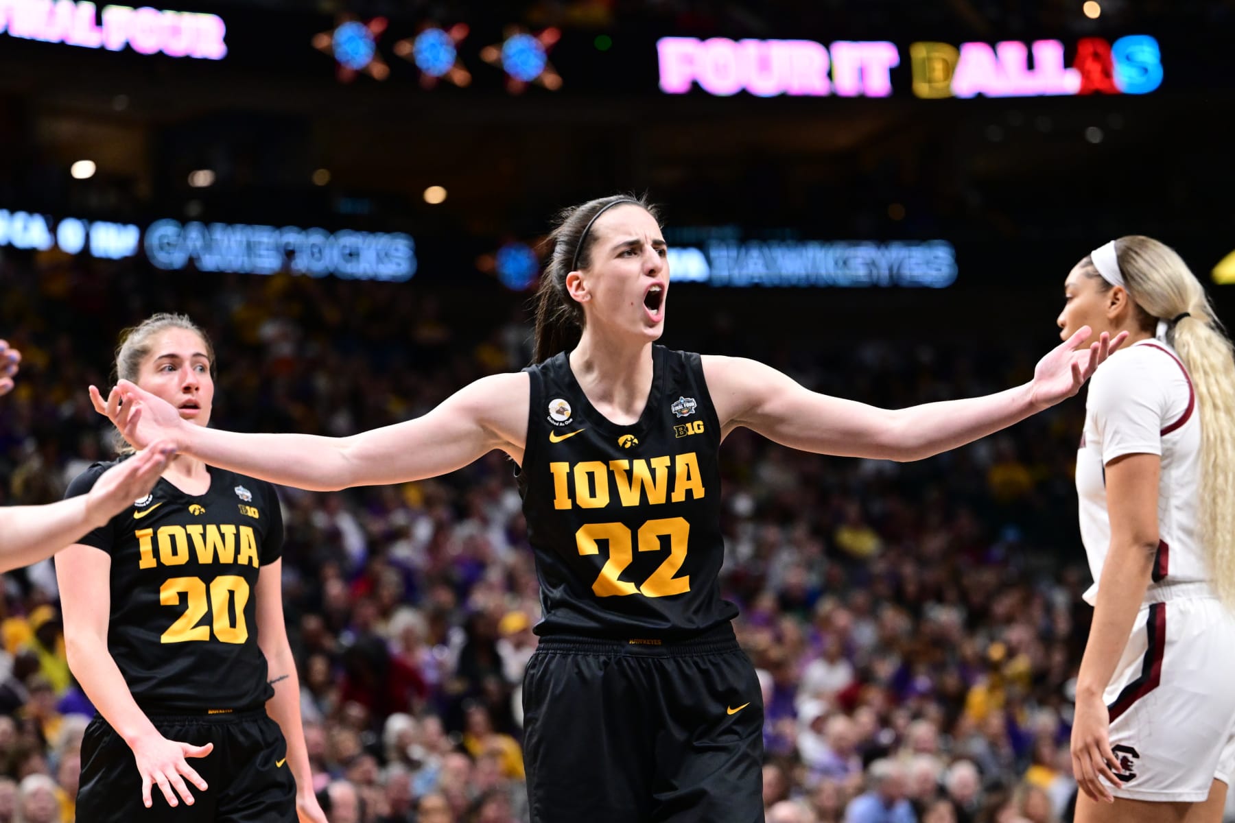 DALLAS, TX - MARCH 31: Caitlin Clark #22 of the Iowa Hawkeyes reacts to a playa against the South Carolina Gamecocks during the semifinals of the NCAA Womens Basketball Tournament Final Four at American Airlines Center on March 31, 2023 in Dallas, Texas. (Photo by Ben Solomon/NCAA Photos via Getty Images)