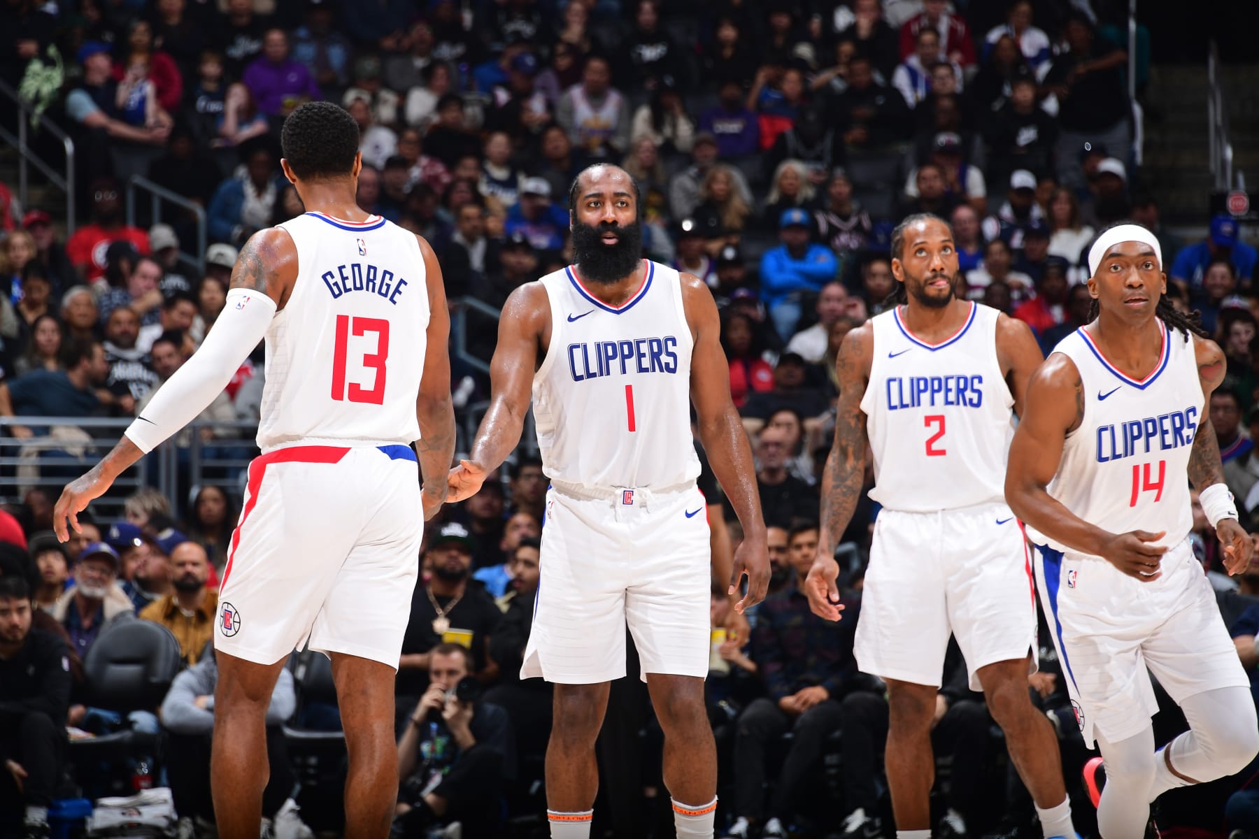 LOS ANGELES, CA - JANUARY 21: Paul George #13, James Harden #1, Kawhi Leonard #2 and Terance Mann #14 of the LA Clippers looks on during the game against the Brooklyn Nets on January 21, 2024 at Crypto.Com Arena in Los Angeles, California. NOTE TO USER: User expressly acknowledges and agrees that, by downloading and/or using this Photograph, user is consenting to the terms and conditions of the Getty Images License Agreement. Mandatory Copyright Notice: Copyright 2024 NBAE (Photo by Adam Pantozzi/NBAE via Getty Images)