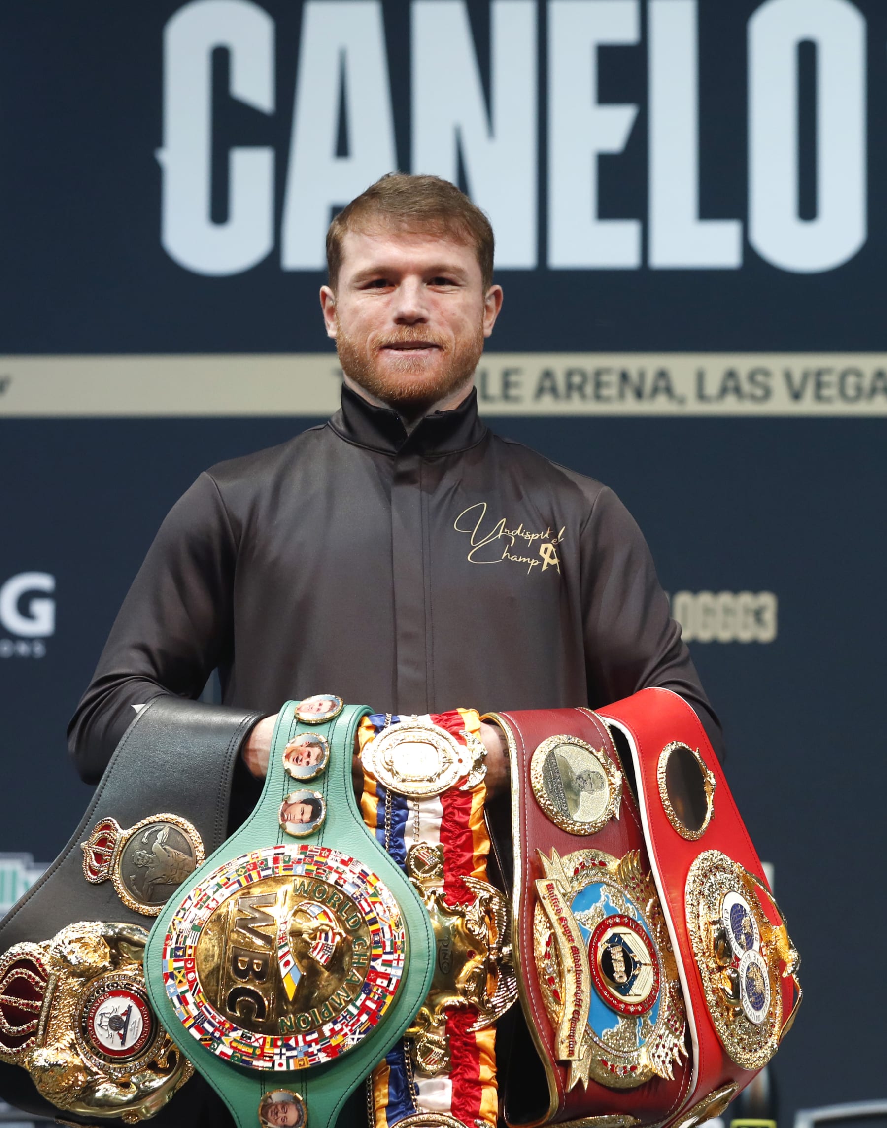 LAS VEGAS, NEVADA - SEPTEMBER 15: Undisputed super middleweight boxer Canelo Alvarez poses with his title belts during a news conference at the KA Theatre at MGM Grand Hotel & Casino on September 15, 2022 in Las Vegas, Nevada. Alvarez will defend his titles against Gennadiy Golovkin at T-Mobile Arena in Las Vegas on Saturday, Sept. 17. (Photo by Steve Marcus/Getty Images)