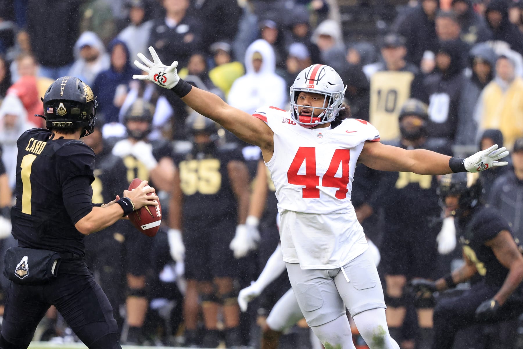 WEST LAFAYETTE, INDIANA - OCTOBER 14: JT Tuimoloau #44 of the Ohio State Buckeyes rushes Hudson Card #1 of the Purdue Boilermakers at Ross-Ade Stadium on October 14, 2023 in West Lafayette, Indiana. (Photo by Justin Casterline/Getty Images)