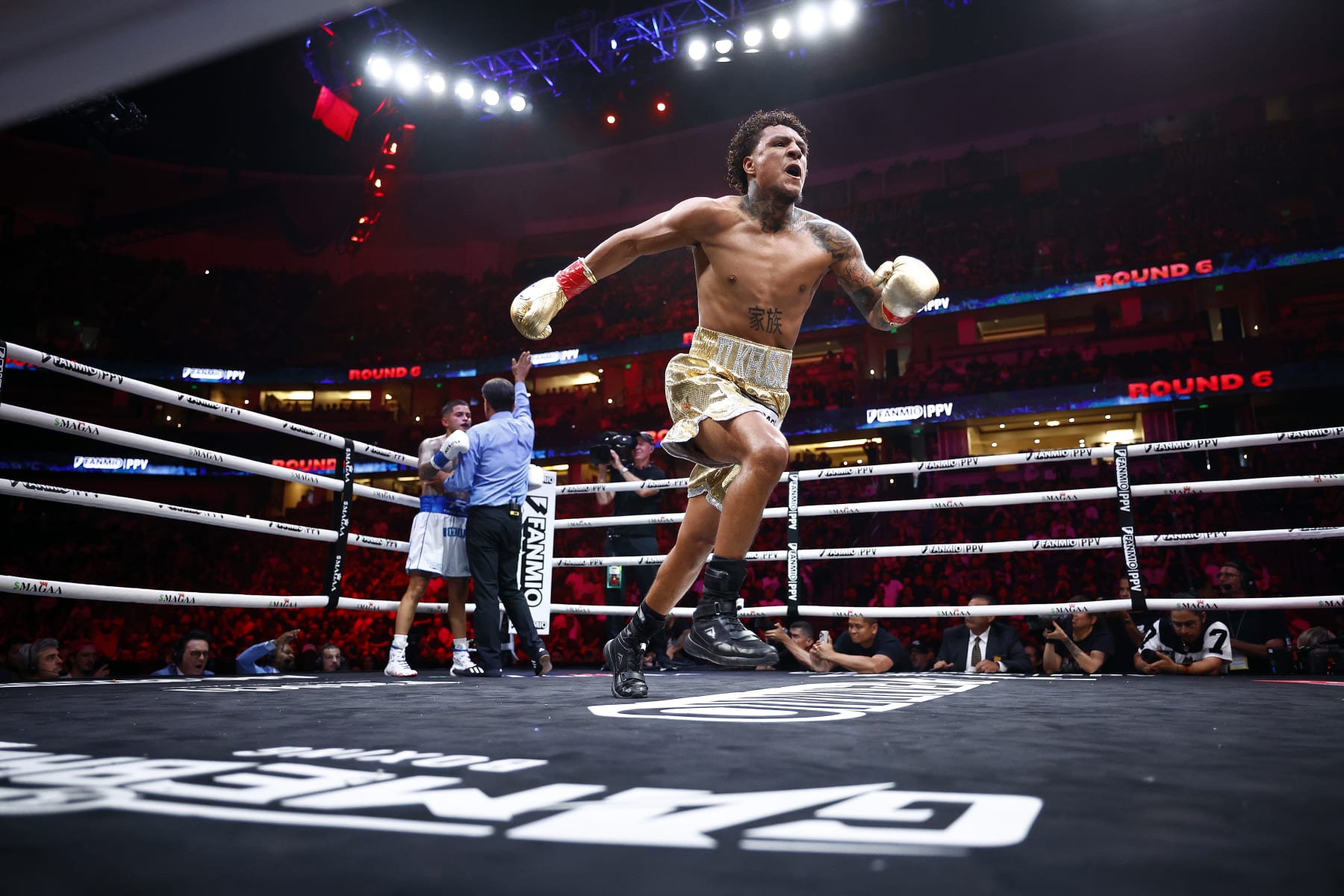 ANAHEIM, CALIFORNIA - JULY 06: Amado Vargas celebrates a knockout against Sean Garcia during round of their lightweights fight at Honda Center on July 06, 2024 in Anaheim, California. (Photo by Ronald Martinez/Getty Images)