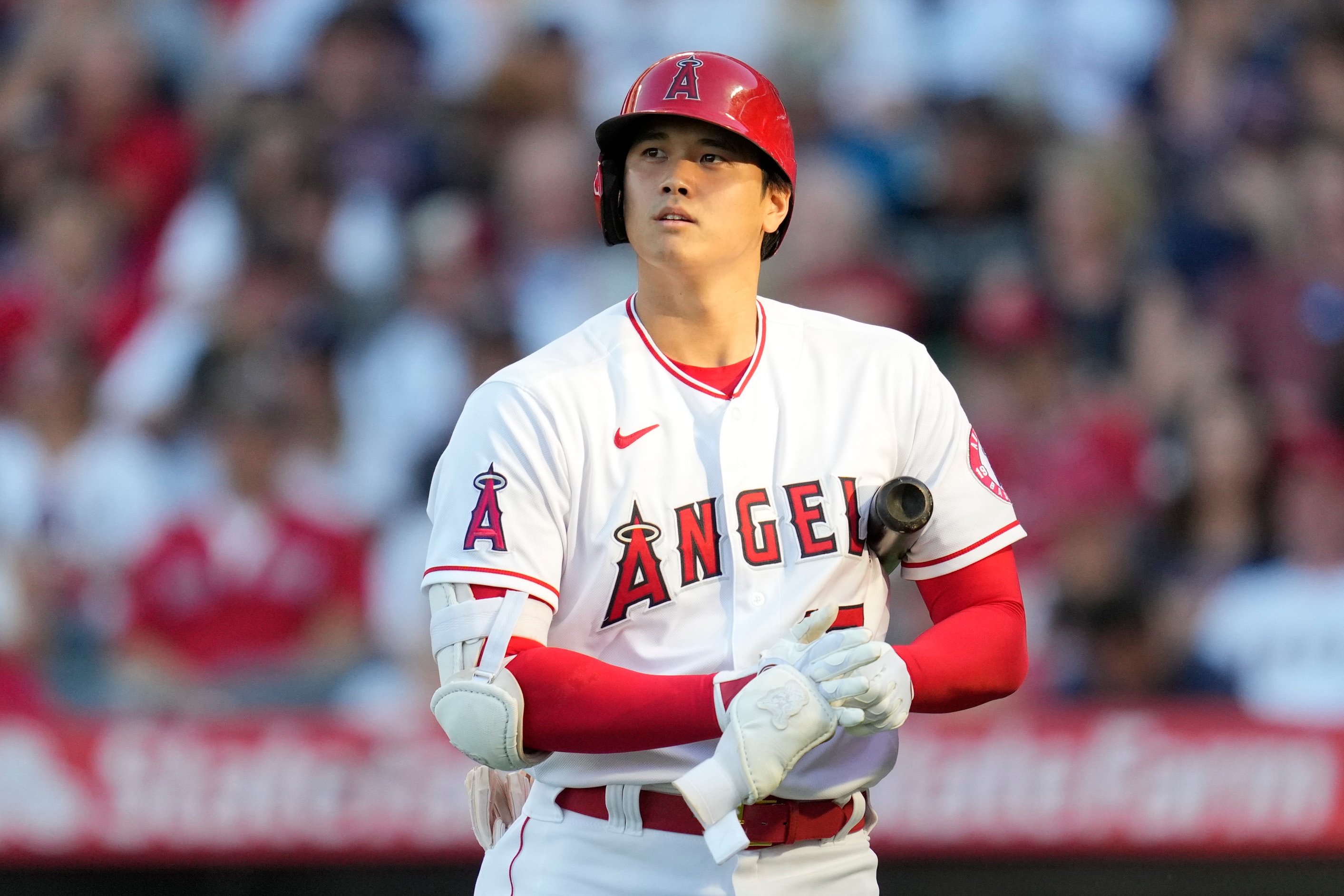 Los Angeles Angels designated hitter Shohei Ohtani (17) walks back to the dugout after striking out during the first inning of a baseball game against the Boston Red Sox Monday, July 5, 2021, in Anaheim, Calif. (AP Photo/Ashley Landis)