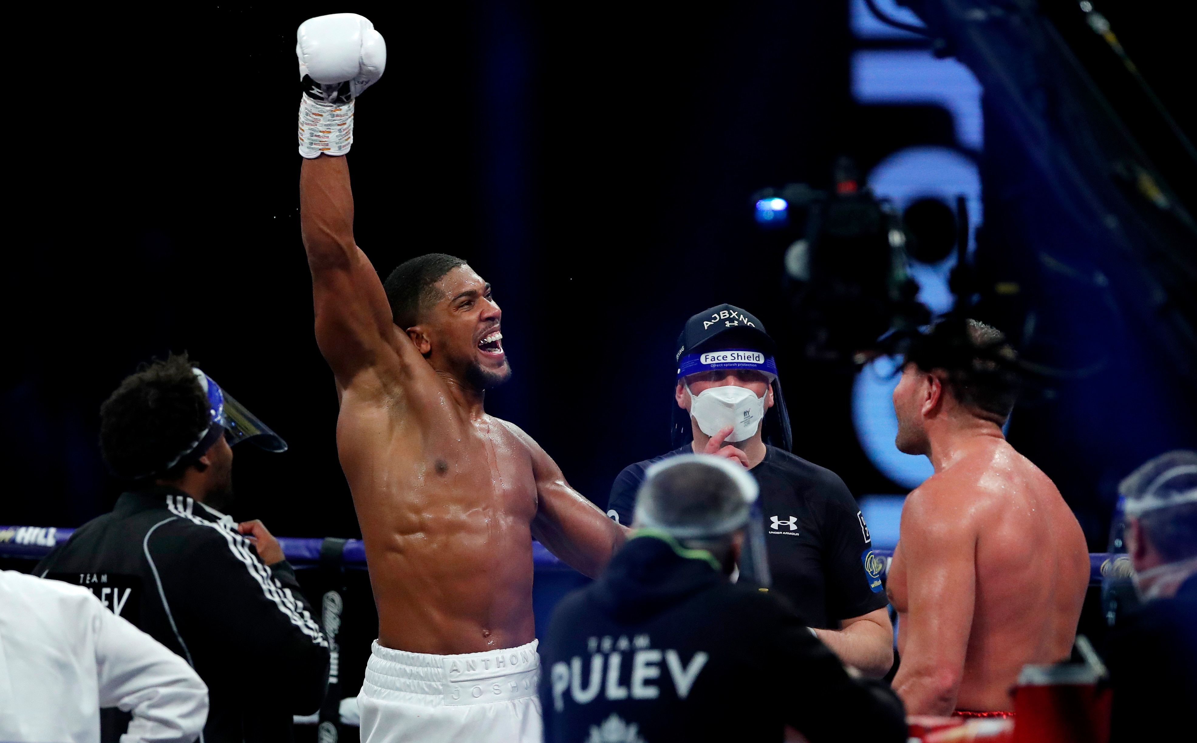 LONDON, ENGLAND - DECEMBER 12: Anthony Joshua reacts to victory over Kubrat Pulev during the IBF, WBA, WBO and IBO World Heayweight Title fight between Anthony Joshua and Kubrat Pulev at The SSE Arena, Wembley on December 12, 2020 in London, England. A limited number of fans (1000) are welcomed back to sporting venues to watch elite sport across England. This was following easing of restrictions on spectators in tiers one and two areas only. (Photo by Andrew Couldridge - Pool/Getty Images)