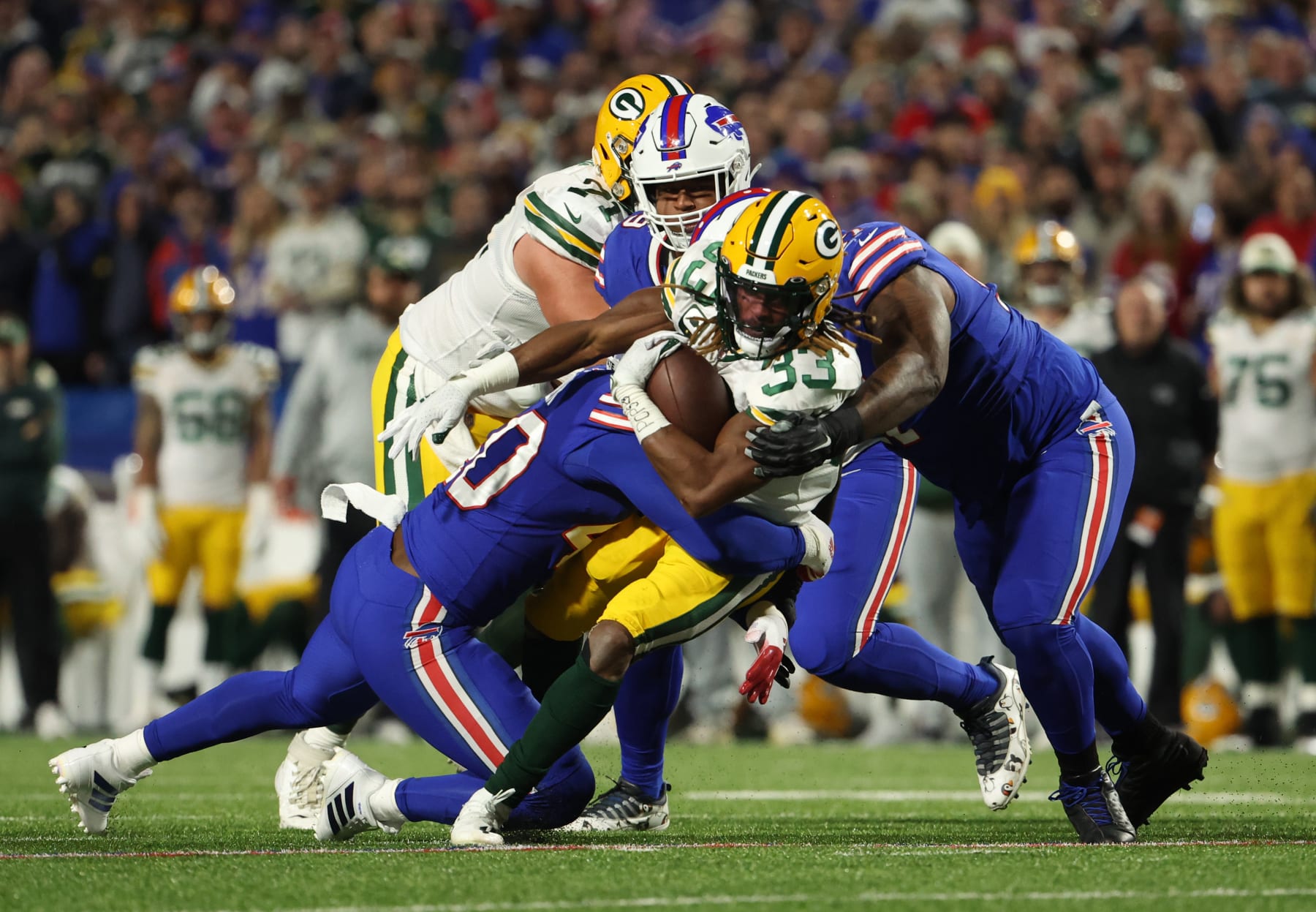 ORCHARD PARK, NEW YORK - OCTOBER 30: Aaron Jones #33 of the Green Bay Packers rushes during the second quarter against the Buffalo Bills at Highmark Stadium on October 30, 2022 in Orchard Park, New York. (Photo by Timothy T Ludwig/Getty Images)