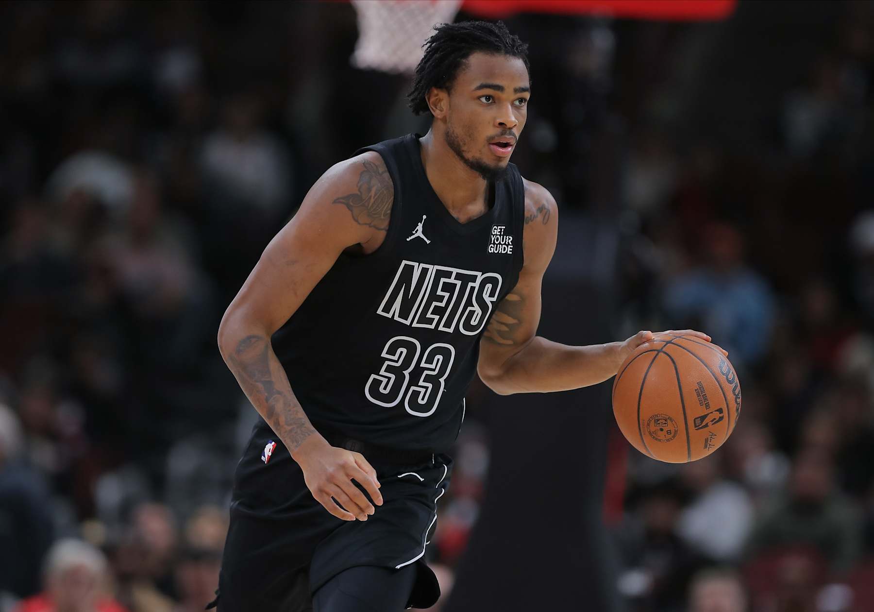 CHICAGO, IL - DECEMBER 02: Nic Claxton #33 of the Brooklyn Nets brings the ball up court during the second half against the Chicago Bulls on December 2, 2024 at the United Center in Chicago, Illinois. (Photo by Melissa Tamez/Icon Sportswire via Getty Images)