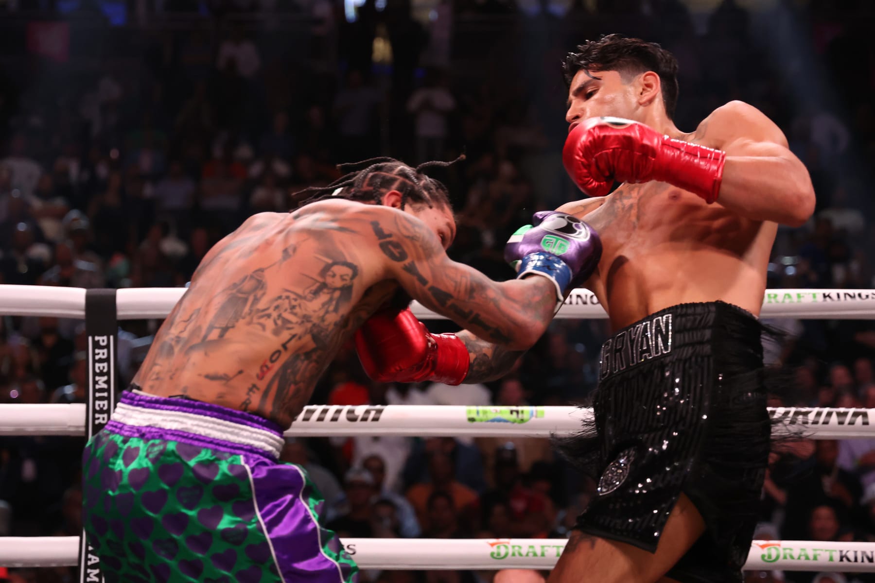 LAS VEGAS, NEVADA - APRIL 22: Ryan Garcia in the black trunks exchanges punches with Gervonta Davis in the green and purple trunks during their catchweight bout at T-Mobile Arena on April 22, 2023 in Las Vegas, Nevada. (Photo by Al Bello/Getty Images)