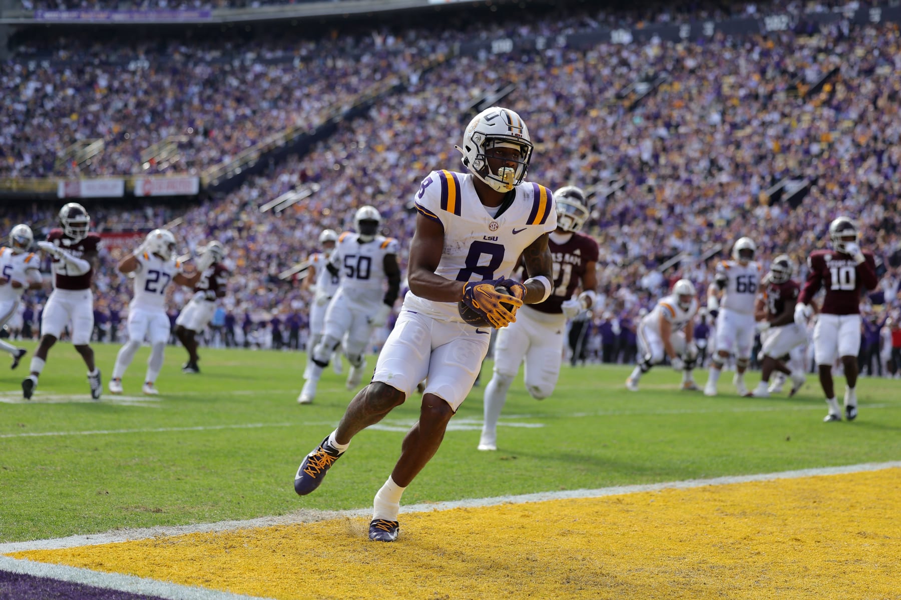 BATON ROUGE, LOUISIANA - NOVEMBER 25: Malik Nabers #8 of the LSU Tigers scores a touchdown against the Texas A&M Aggies during a game at Tiger Stadium on November 25, 2023 in Baton Rouge, Louisiana. (Photo by Jonathan Bachman/Getty Images)