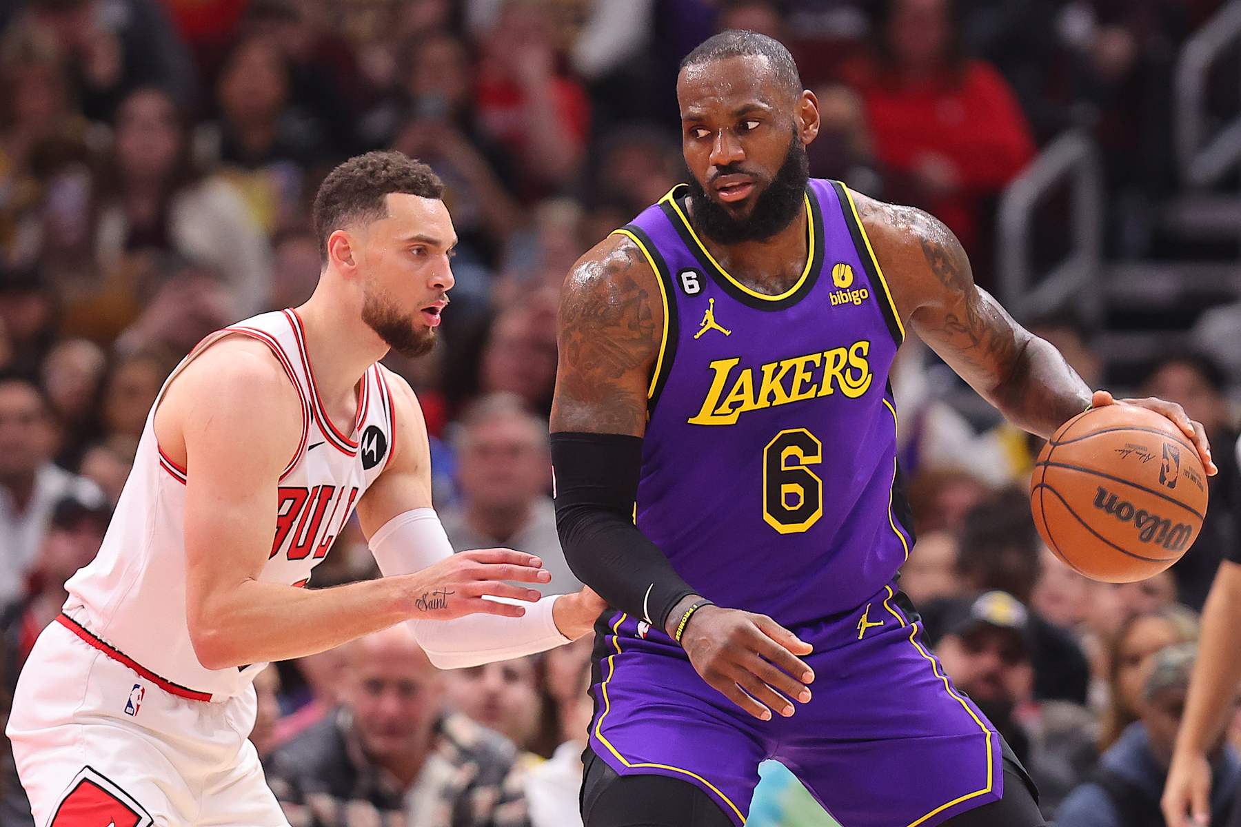 CHICAGO, ILLINOIS - MARCH 29: LeBron James #6 of the Los Angeles Lakers is defended by Zach LaVine #8 of the Chicago Bulls during the first half at United Center on March 29, 2023 in Chicago, Illinois. NOTE TO USER: User expressly acknowledges and agrees that, by downloading and or using this photograph, User is consenting to the terms and conditions of the Getty Images License Agreement. (Photo by Michael Reaves/Getty Images)