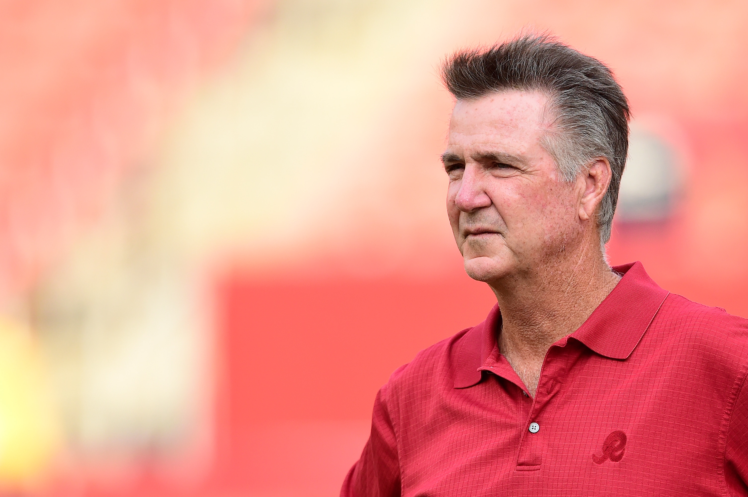 LANDOVER, MD - AUGUST 15: Washington Redskins team president Bruce Allen watches the Redskins warm up before a preseason game against the Cincinnati Bengals at FedExField on August 15, 2019 in Landover, Maryland. (Photo by Patrick McDermott/Getty Images)