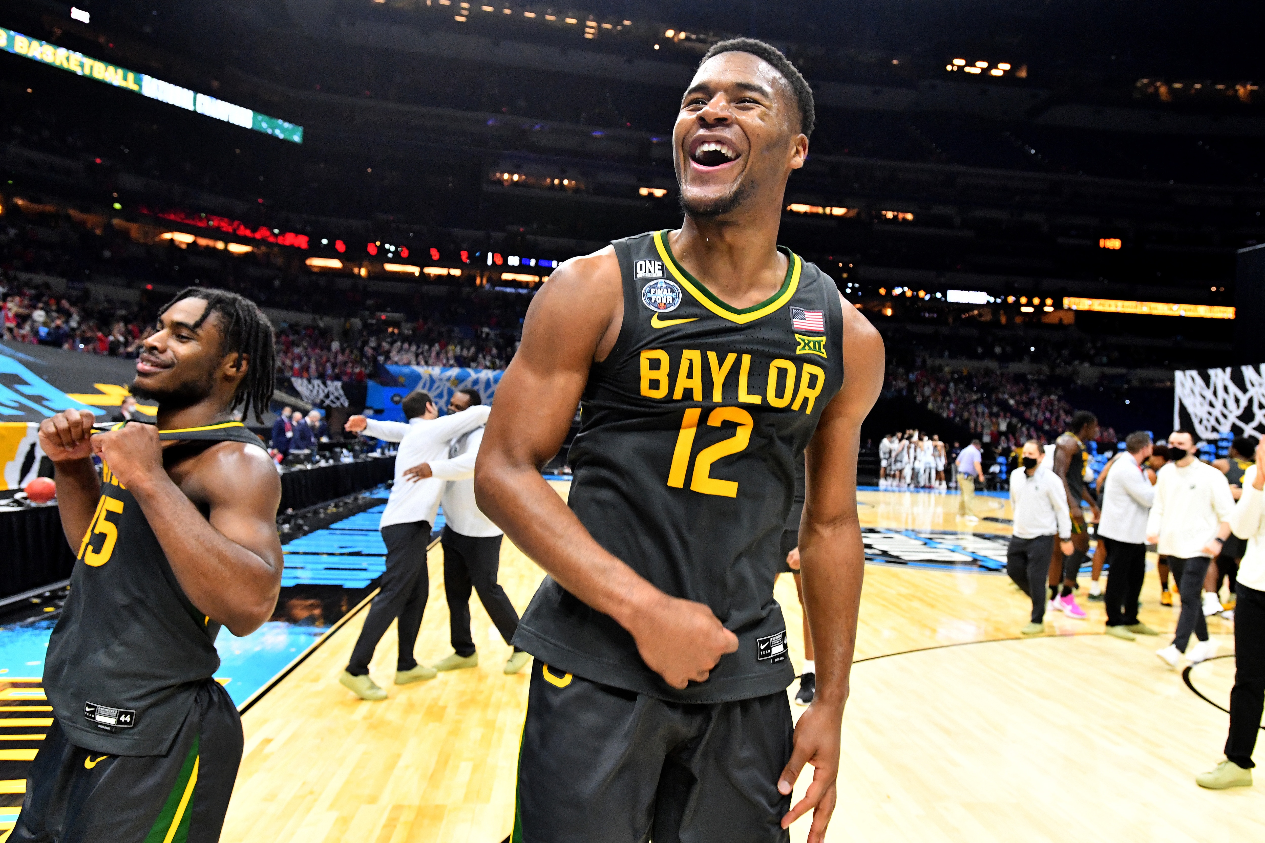 INDIANAPOLIS, INDIANA - APRIL 05:  Davion Mitchell #45and Jared Butler #12 of the Baylor Bears elebrate their win against the Gonzaga Bulldogs in the National Championship game of the 2021 NCAA Men's Basketball Tournament at Lucas Oil Stadium on April 05, 2021 in Indianapolis, Indiana. (Photo by Brett Wilhelm/NCAA Photos via Getty Images)