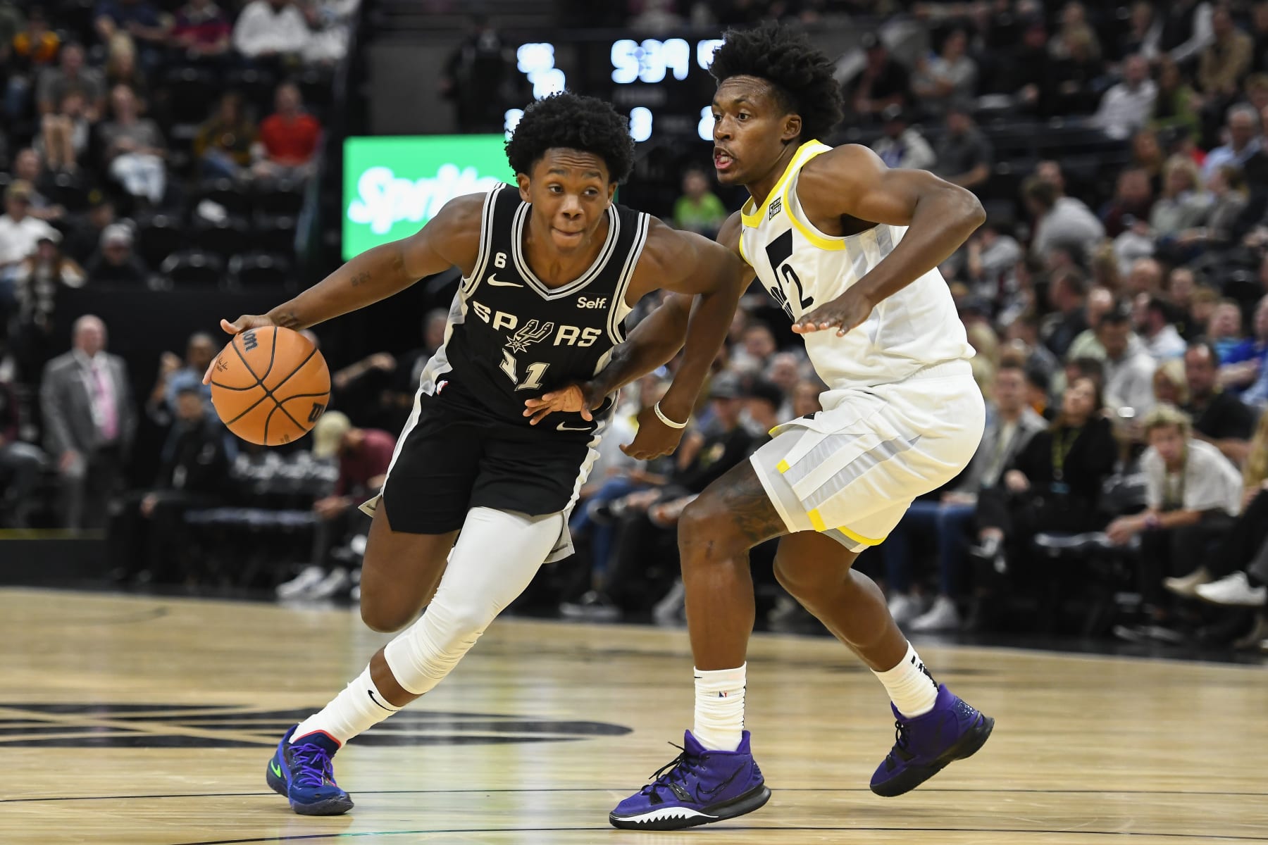 SALT LAKE CITY, UTAH - OCTOBER 11: Joshua Primo #11 of the San Antonio Spurs drives into Collin Sexton #2 of the Utah Jazz during a game at Vivint Arena on October 11, 2022 in Salt Lake City, Utah. NOTE TO USER: User expressly acknowledges and agrees that, by downloading and or using this photograph, User is consenting to the terms and conditions of the Getty Images License Agreement. (Photo by Alex Goodlett/Getty Images)