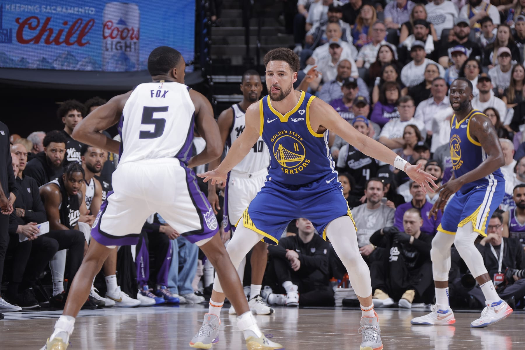 SACRAMENTO, CA - APRIL 16: Klay Thompson #11 of the Golden State Warriors defends against De'Aaron Fox #5 of the Sacramento Kings during the game during the 2024 Play-In Tournament on April 16, 2024 at Golden 1 Center in Sacramento, California. NOTE TO USER: User expressly acknowledges and agrees that, by downloading and or using this photograph, User is consenting to the terms and conditions of the Getty Images Agreement. Mandatory Copyright Notice: Copyright 2024 NBAE (Photo by Rocky Widner/NBAE via Getty Images)