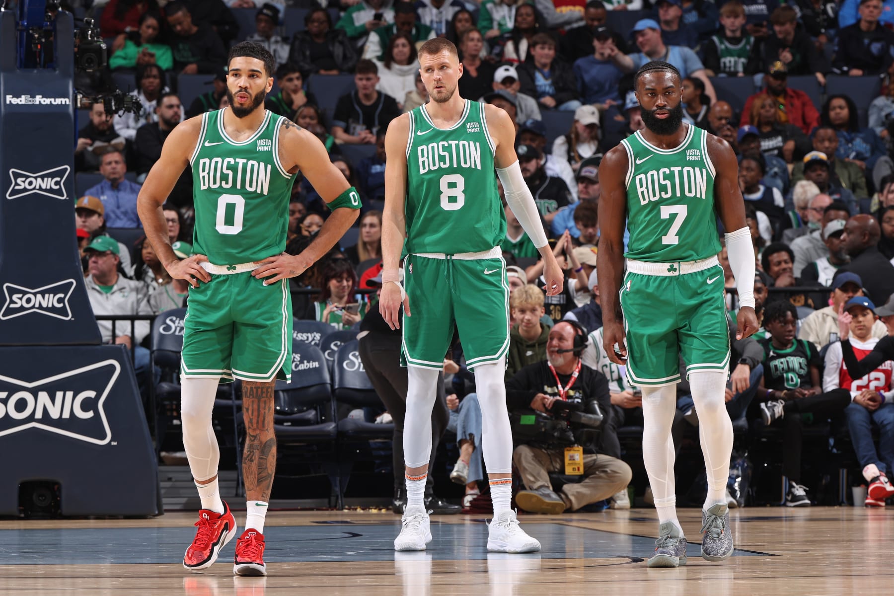 MEMPHIS, TN - NOVEMBER 19: Kristaps Porzingis #8, Jayson Tatum #0, and Jaylen Brown #7 of the Boston Celtics look on during the game against the Memphis Grizzlies on November 19, 2023 at FedExForum in Memphis, Tennessee. NOTE TO USER: User expressly acknowledges and agrees that, by downloading and or using this photograph, User is consenting to the terms and conditions of the Getty Images License Agreement. Mandatory Copyright Notice: Copyright 2023 NBAE (Photo by Joe Murphy/NBAE via Getty Images)