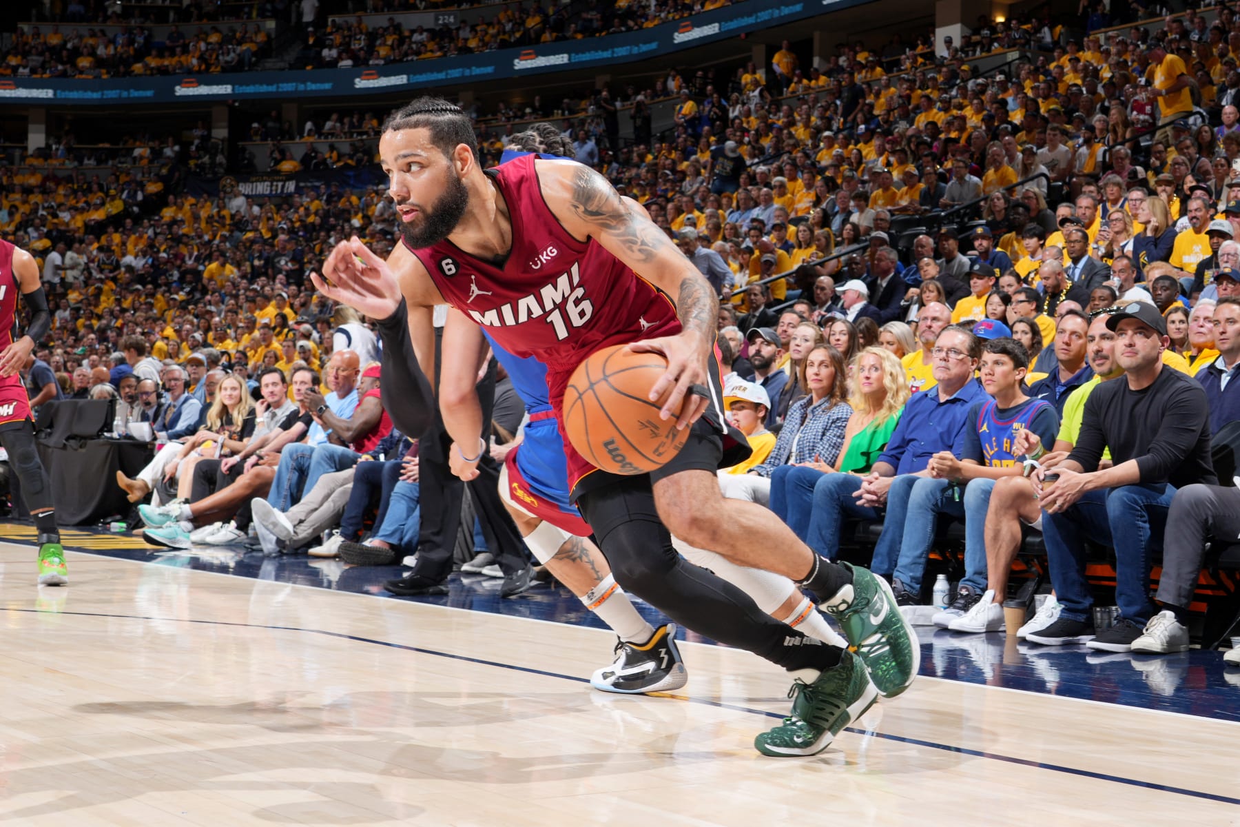 DENVER, CO - JUNE 1: Caleb Martin #16 of the Miami Heat dribbles the ball during Game One of the 2023 NBA Finals against the Denver Nuggets on June 1, 2023 at the Ball Arena in Denver, Colorado. NOTE TO USER: User expressly acknowledges and agrees that, by downloading and/or using this Photograph, user is consenting to the terms and conditions of the Getty Images License Agreement. Mandatory Copyright Notice: Copyright 2023 NBAE (Photo by Jesse D. Garrabrant/NBAE via Getty Images)