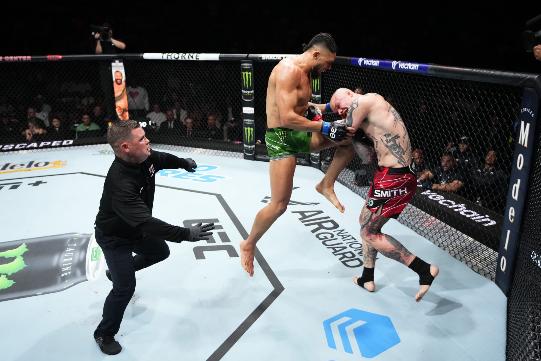 CHARLOTTE, NORTH CAROLINA - MAY 13:  (L-R) Johnny Walker of Brazil knees Anthony Smith in their light heavyweight fight during the UFC Fight Night event at Spectrum Center on May 13, 2023 in Charlotte, North Carolina. (Photo by Jeff Bottari/Zuffa LLC via Getty Images)