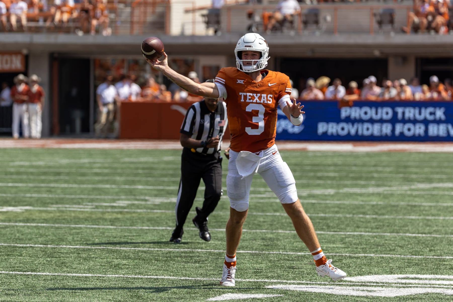AUSTIN, TX - SEPTEMBER 02: Texas Longhorns quarterback Quinn Ewers (3) makes a pass as he rolls out of the pocket during the college football game between Texas Longhorns and Rice Owls on September 2, 2023, at Darrell K Royal-Texas Memorial Stadium in Austin, TX.  (Photo by David Buono/Icon Sportswire via Getty Images)
