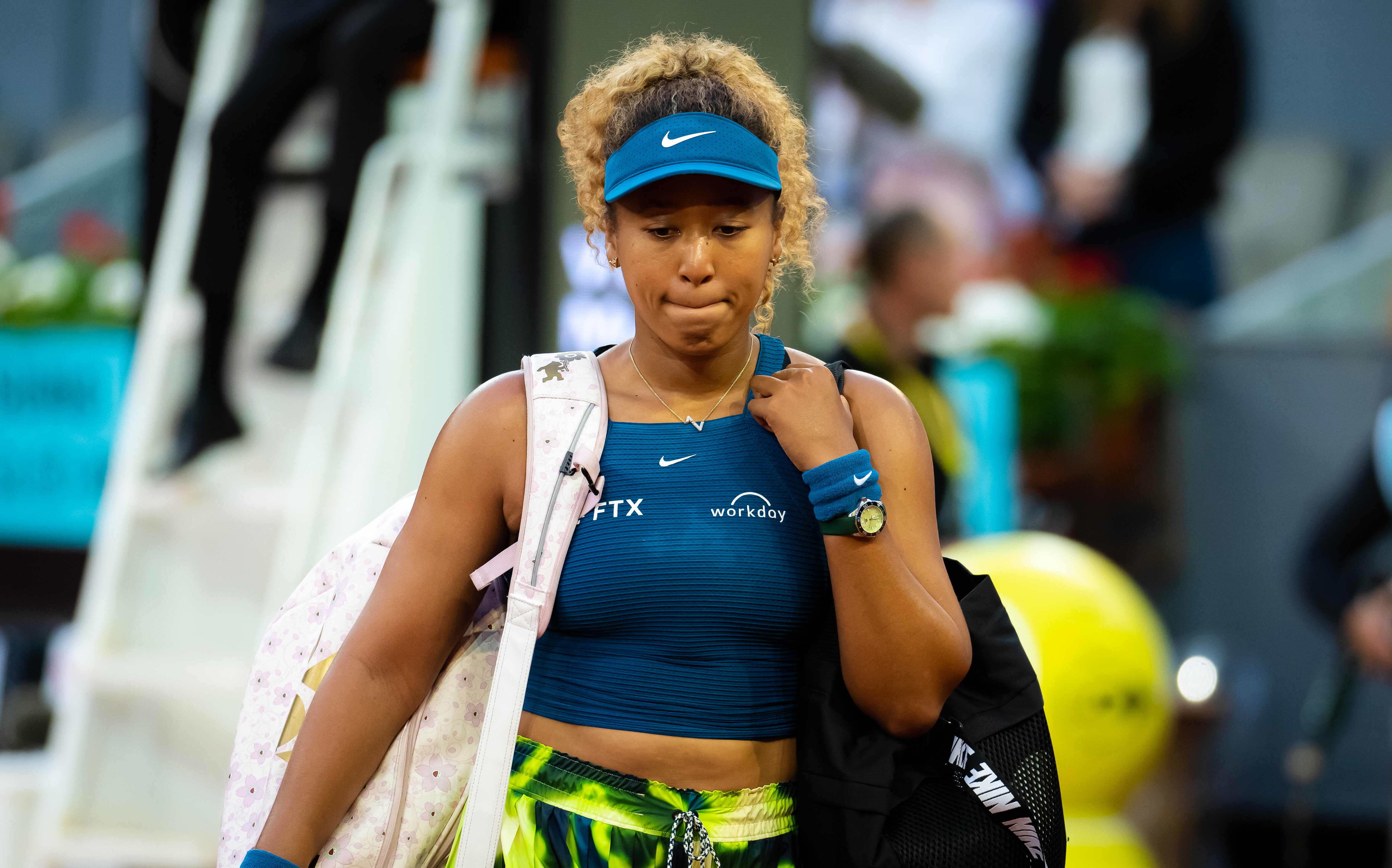 MADRID, SPAIN - MAY 01: Naomi Osaka of Japan walks off the court after losing to Sara Sorribes Tormo of Spain in her second round match on Day 4 of the Mutua Madrid Open at La Caja Magica on May 01, 2022 in Madrid, Spain (Photo by Robert Prange/Getty Images)