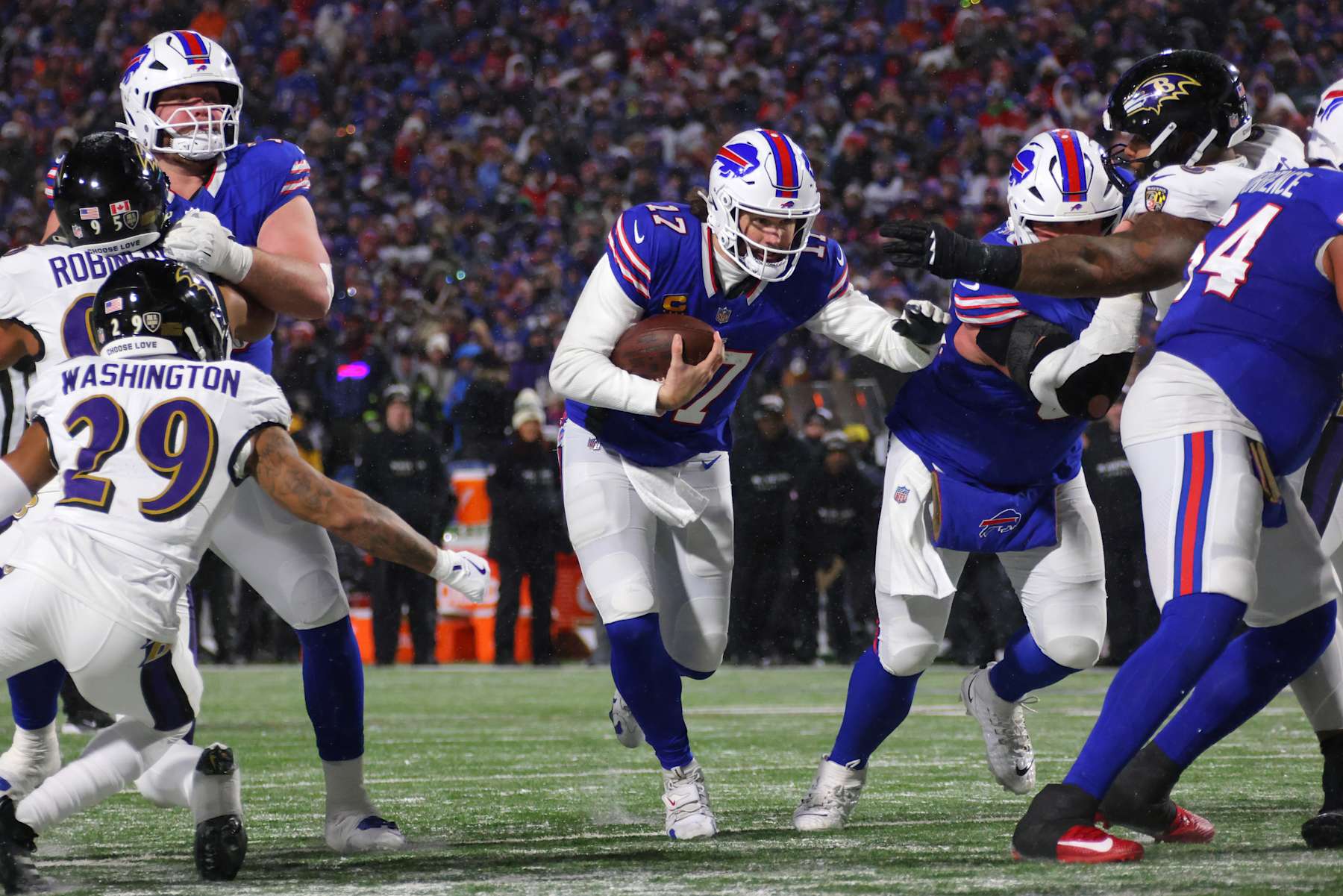 Buffalo Bills quarterback Josh Allen runs the ball against the Baltimore Ravens. 