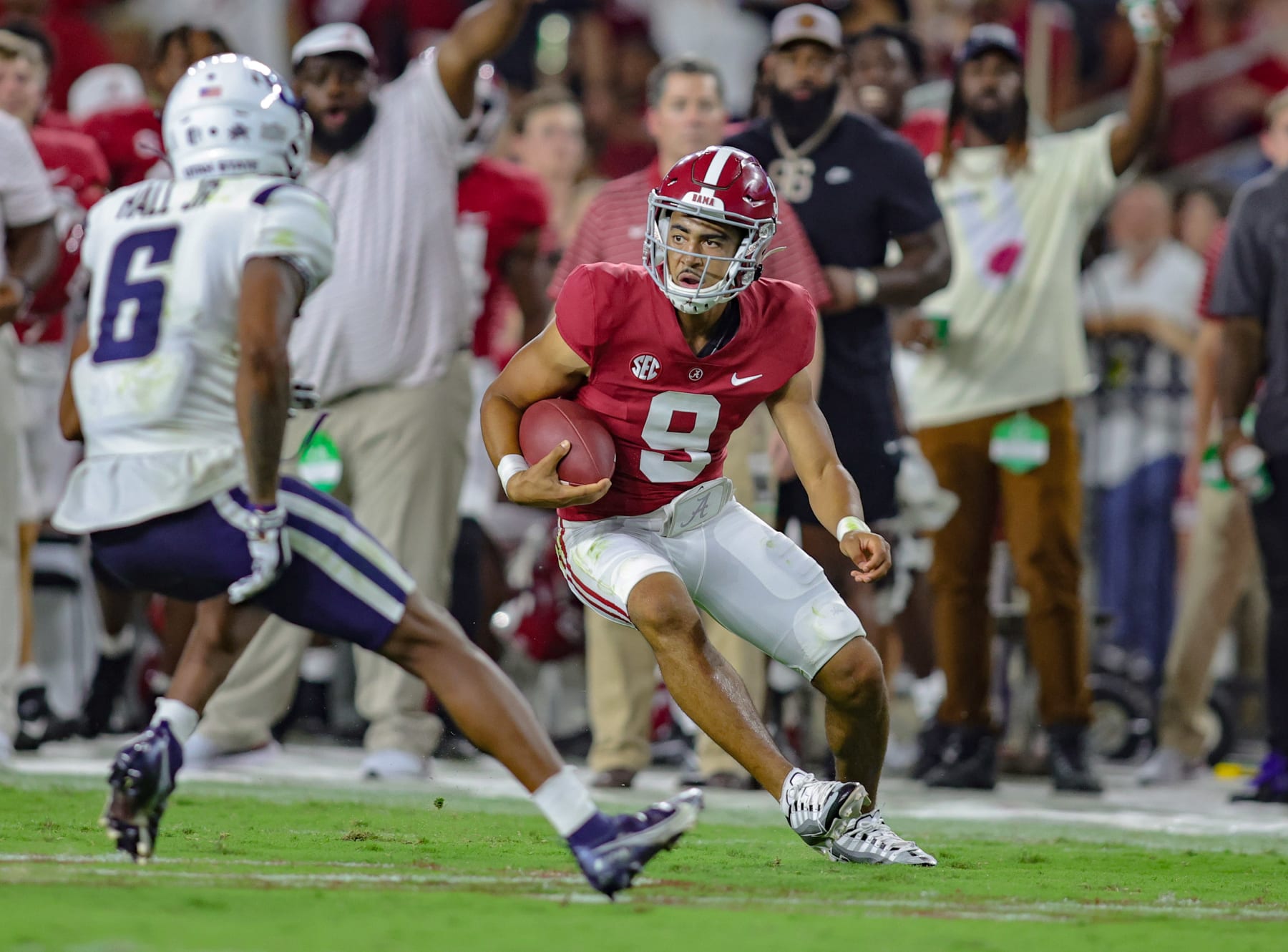 TUSCALOOSA, ALABAMA - SEPTEMBER 3: Bryce Young #9 of the Alabama Crimson Tide puts the moves on Gurvan Hall Jr. #6 of the Utah State Aggies at Bryant Denny Stadium on September 3, 2022 in Tuscaloosa, Alabama. (Photo by Brandon Sumrall/Getty Images)