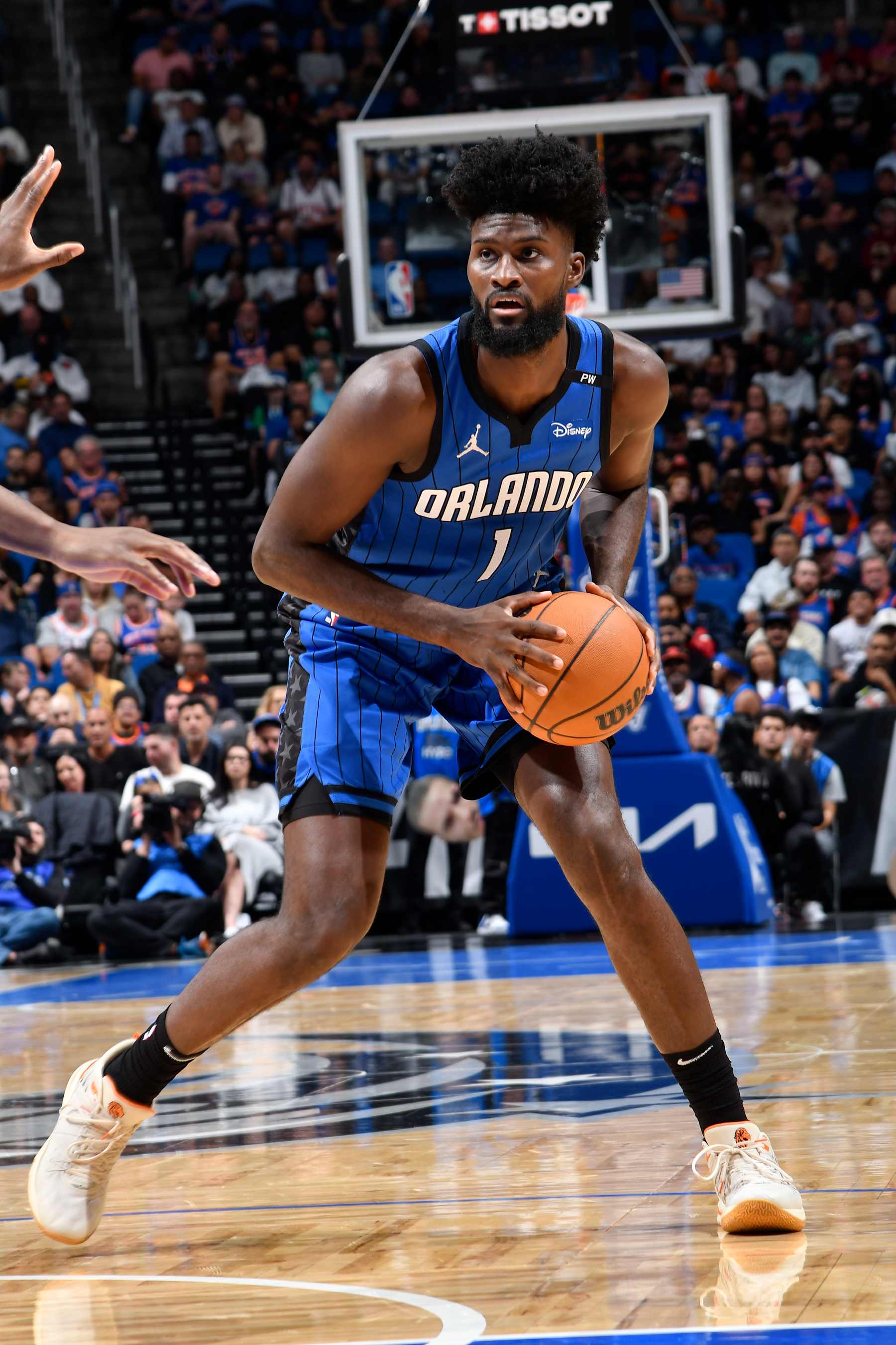 ORLANDO, FL - DECEMBER 27:  Jonathan Isaac #1 of the Orlando Magic handles the ball during the game against the New York Knicks  on December 27, 2024 at Kia Center in Orlando, Florida. NOTE TO USER: User expressly acknowledges and agrees that, by downloading and or using this photograph, User is consenting to the terms and conditions of the Getty Images License Agreement. Mandatory Copyright Notice: Copyright 2024 NBAE (Photo by Fernando Medina/NBAE via Getty Images)