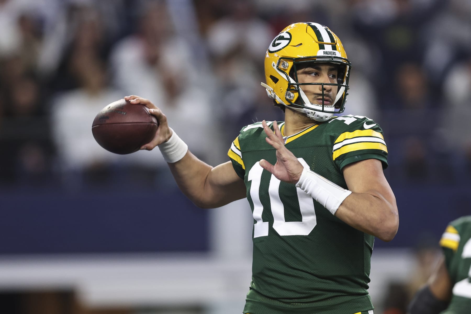 ARLINGTON, TX - JANUARY 14: Jordan Love #10 of the Green Bay Packers throws the ball during an NFL wild-card playoff football game against the Dallas Cowboys at AT&T Stadium on January 14, 2024 in Arlington, Texas. (Photo by Perry Knotts/Getty Images)