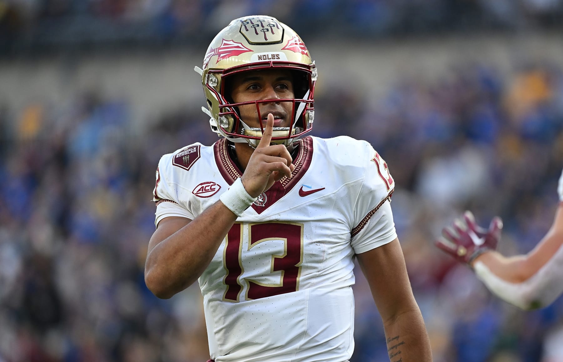 PITTSBURGH, PENNSYLVANIA - NOVEMBER 4: Jordan Travis #13 of the Florida State Seminoles gestures to the crowd after rushing for a 1-yard touchdown in the second quarter during the game against the Pittsburgh Panthers at Acrisure Stadium on November 4, 2023 in Pittsburgh, Pennsylvania. (Photo by Justin Berl/Getty Images) PITTSBURGH, PENNSYLVANIA - NOVEMBER 4: Jordan Travis #13 of the Florida State Seminoles gestures to the crowd after rushing for a 1-yard touchdown in the second quarter during the game against the Pittsburgh Panthers at Acrisure Stadium on November 4, 2023 in Pittsburgh, Pennsylvania. (Photo by Justin Berl/Getty Images)