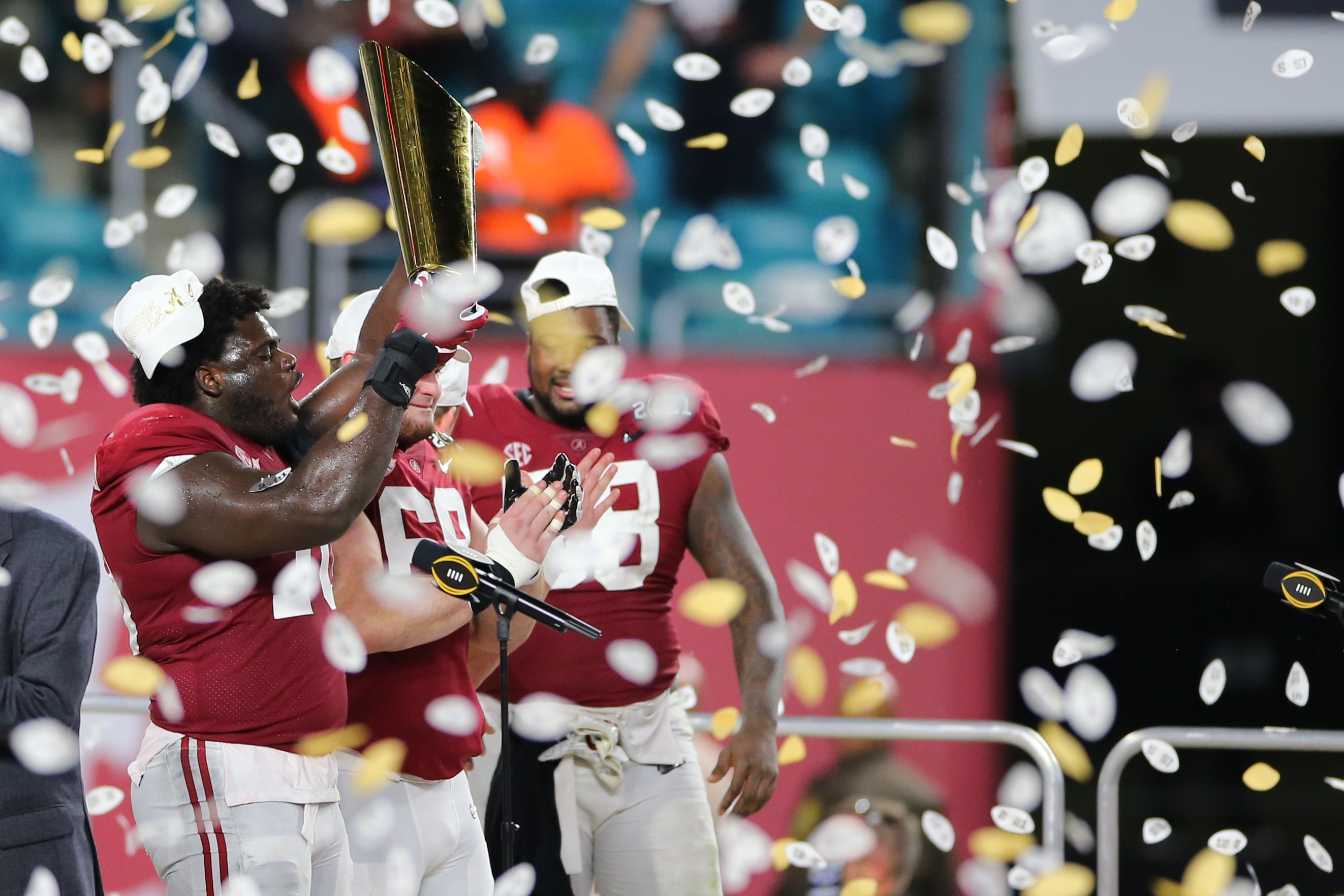 MIAMI GARDENS, FL - JANUARY 11: Alabama Crimson Tide offensive lineman Alex Leatherwood (70) with the National Championship Trophy following the CFP National Championship game between the Alabama Crimson Tide and the Ohio State Buckeyes on January 11, 2021 at Hard Rock Stadium in Miami Gardens, Fl. (Photo by David Rosenblum/Icon Sportswire via Getty Images)