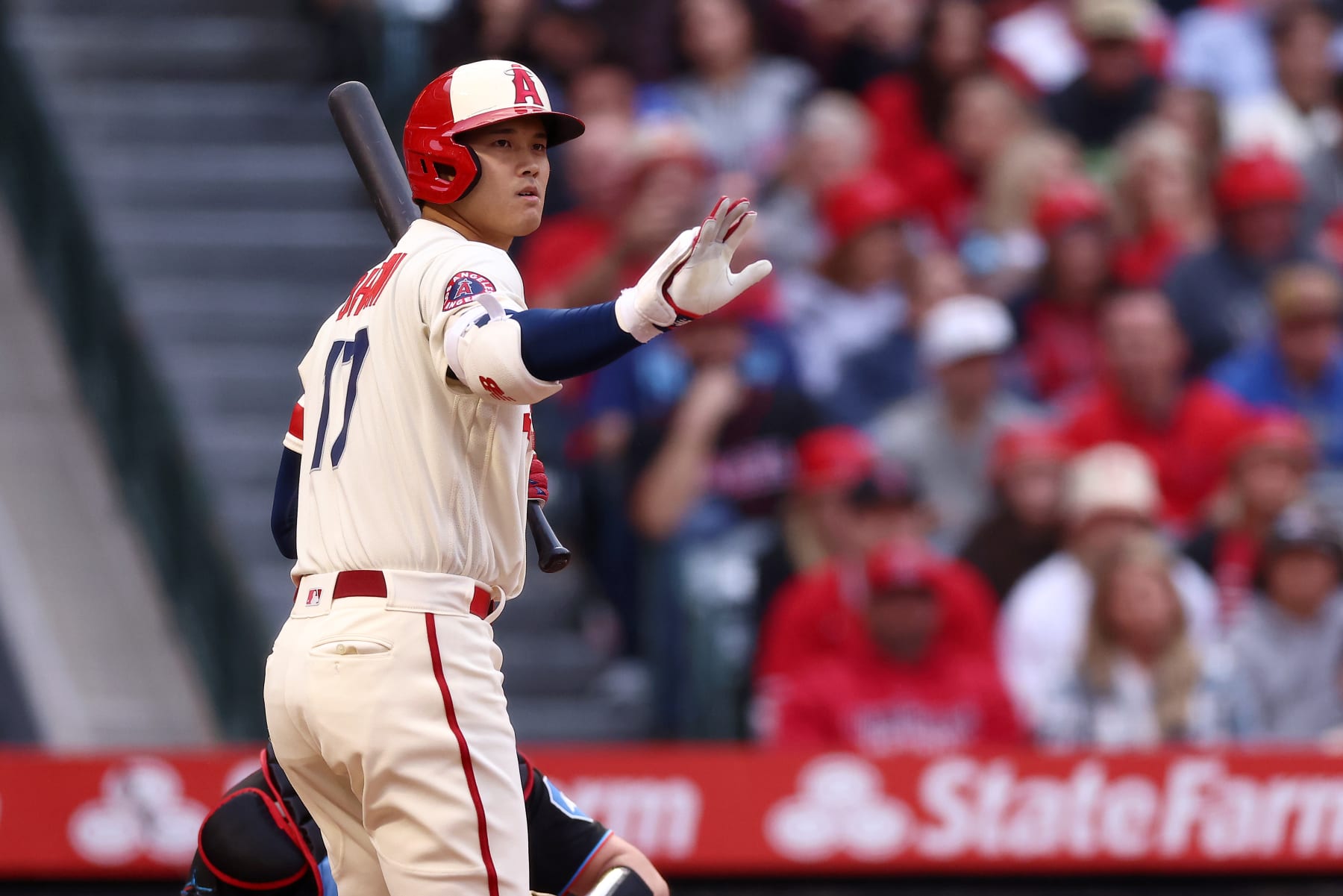 ANAHEIM, CALIFORNIA - MAY 26: Shohei Ohtani #17 of the Los Angeles Angels signals to teammate Mike Trout #27 on first base during the first inning against the Miami Marlins at Angel Stadium of Anaheim on May 26, 2023 in Anaheim, California. (Photo by Katelyn Mulcahy/Getty Images)